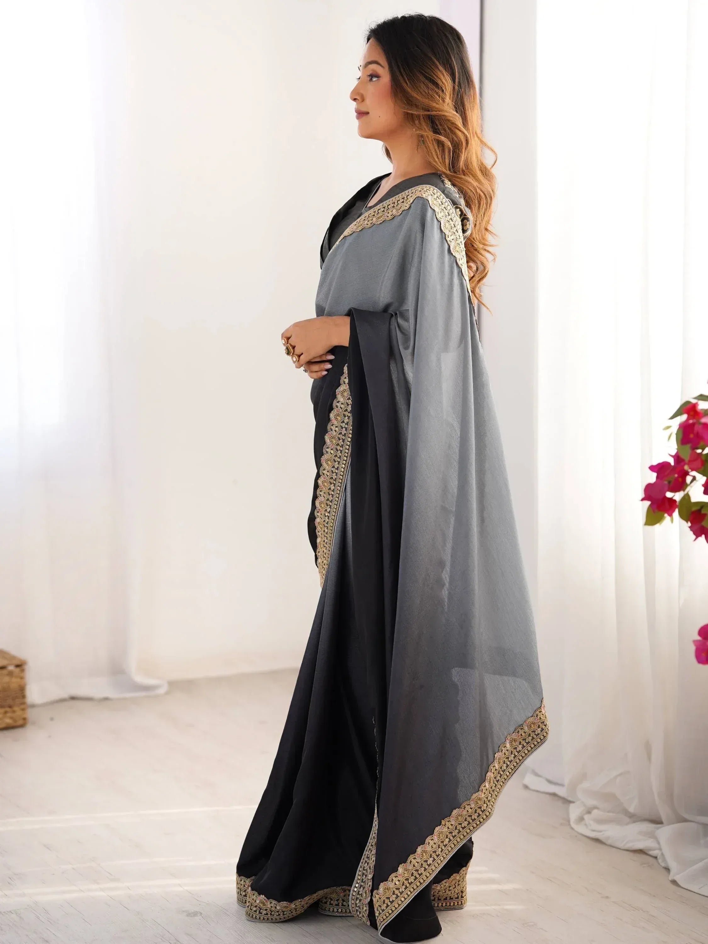 Grey and black ethnic gown with gold embroidery, perfect for Indian occasions and festive wear.