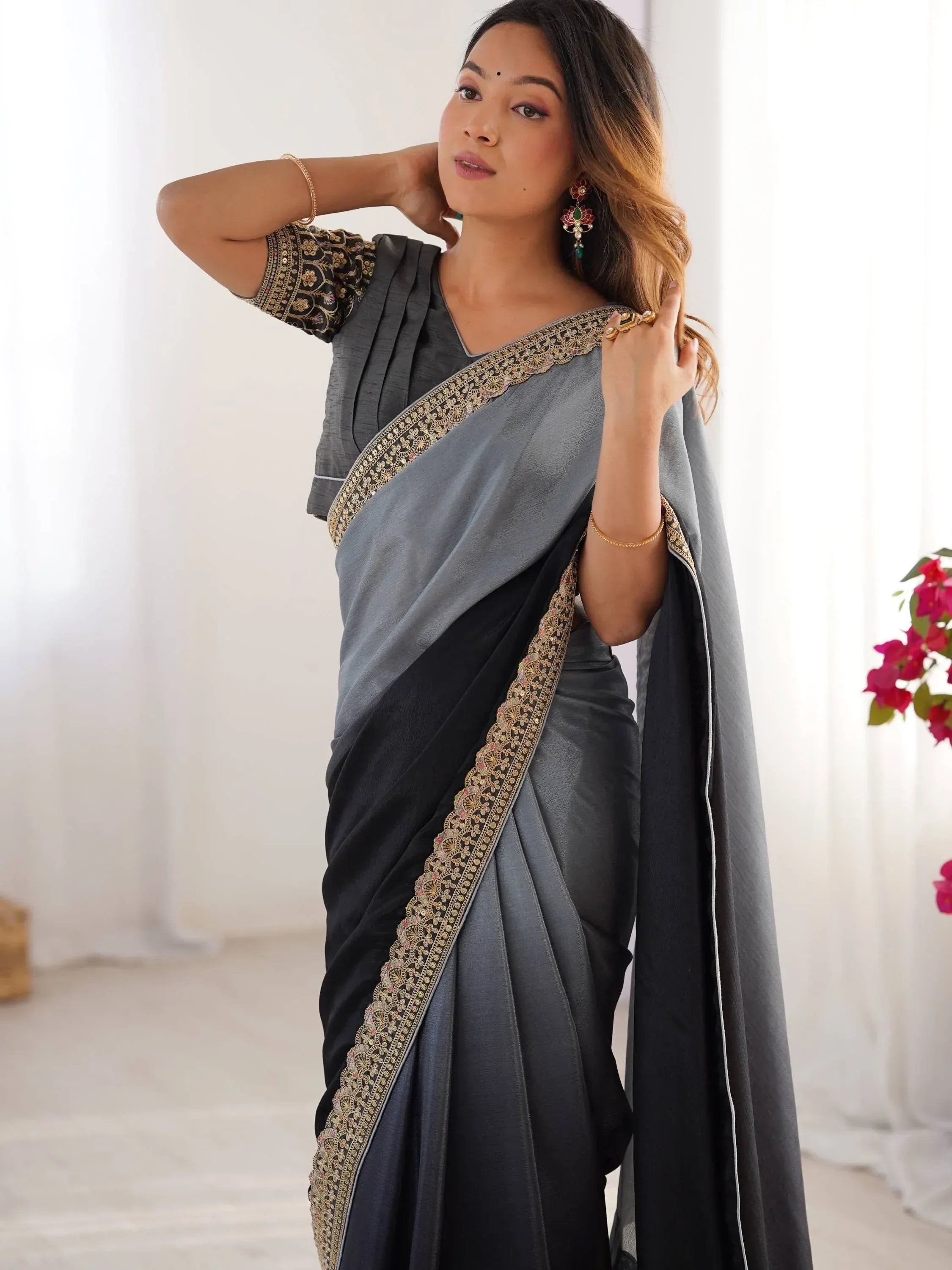 Grey and black saree with gold embroidery, styled with matching blouse for ethnic wear