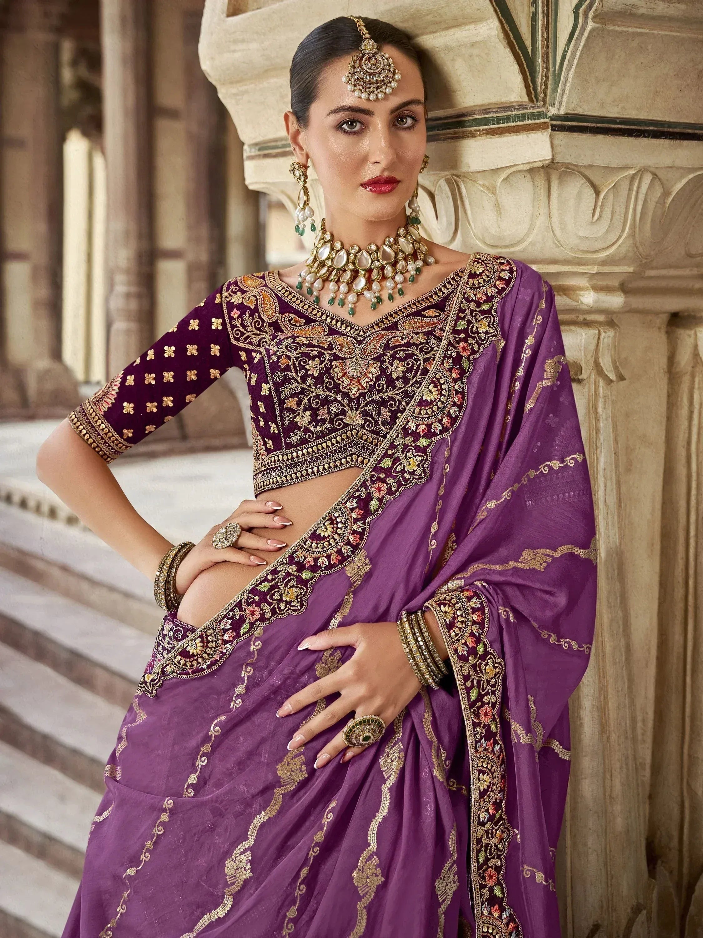 Purple embroidered saree with gold detailing, traditional Indian ethnic wear, perfect for weddings and festivals
