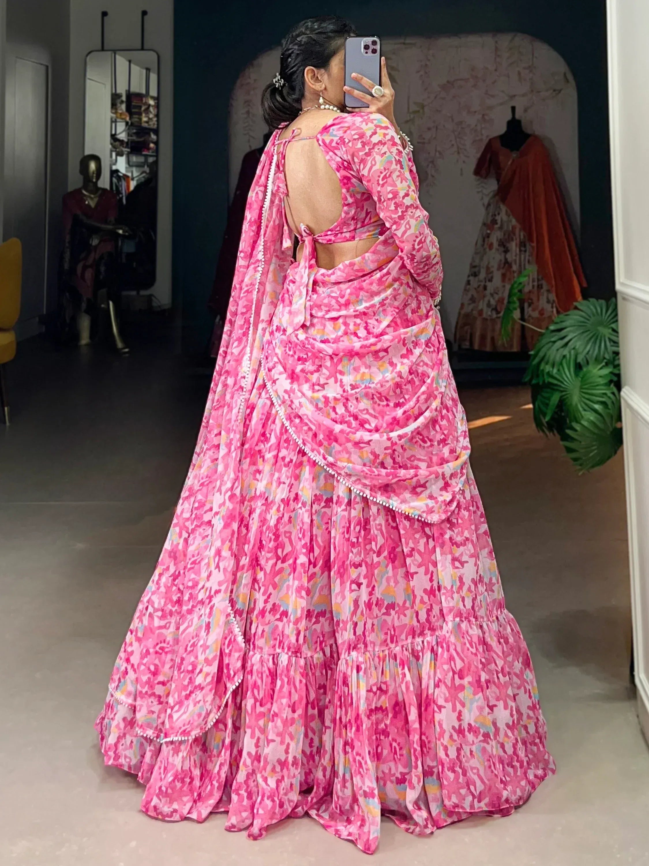 Pink floral lehenga choli with backless blouse and ruffled skirt, perfect for Indian ethnic wear occasions
