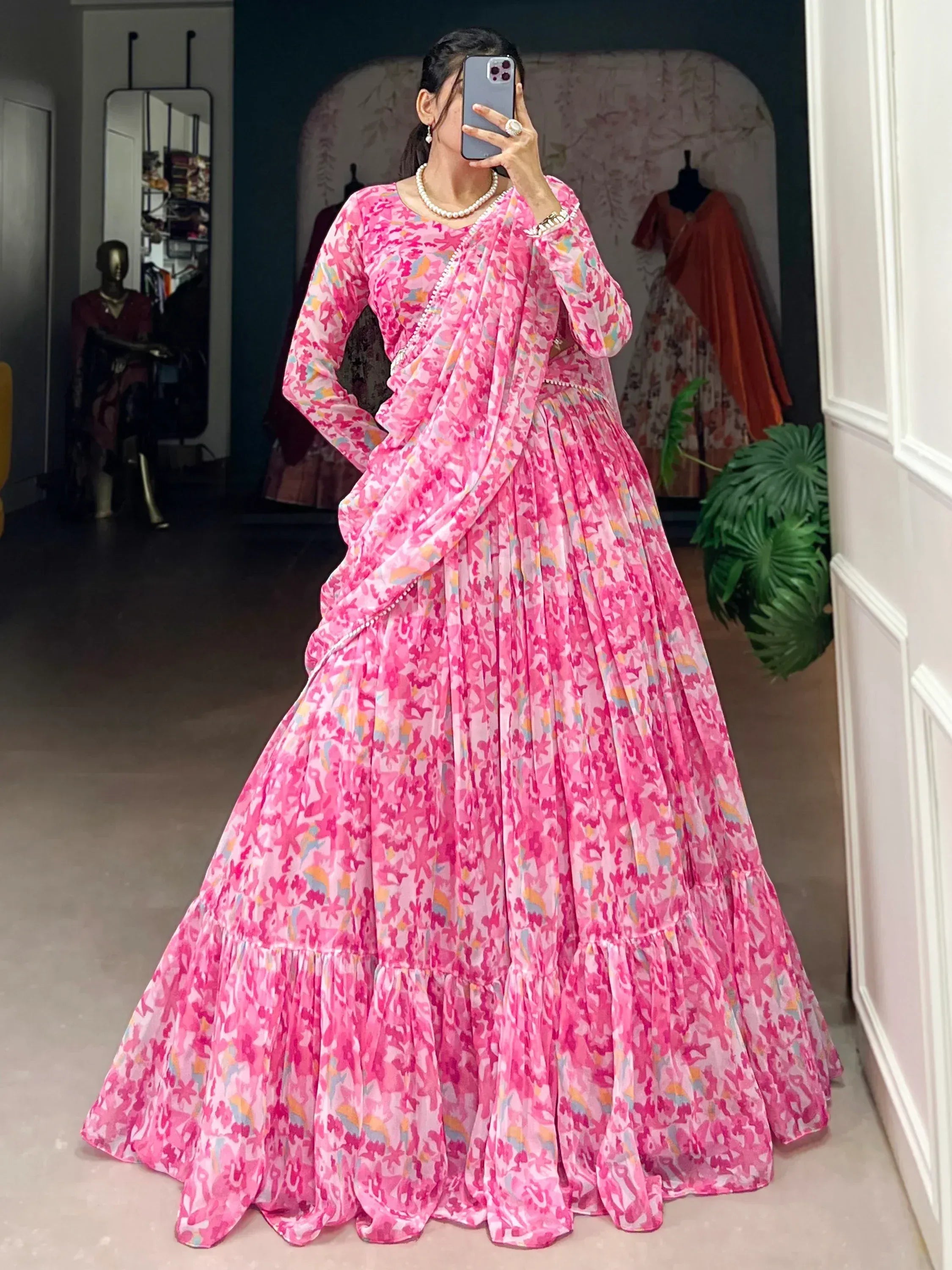 Pink floral printed lehenga choli with pearl embellishments, perfect for Indian ethnic wear occasions