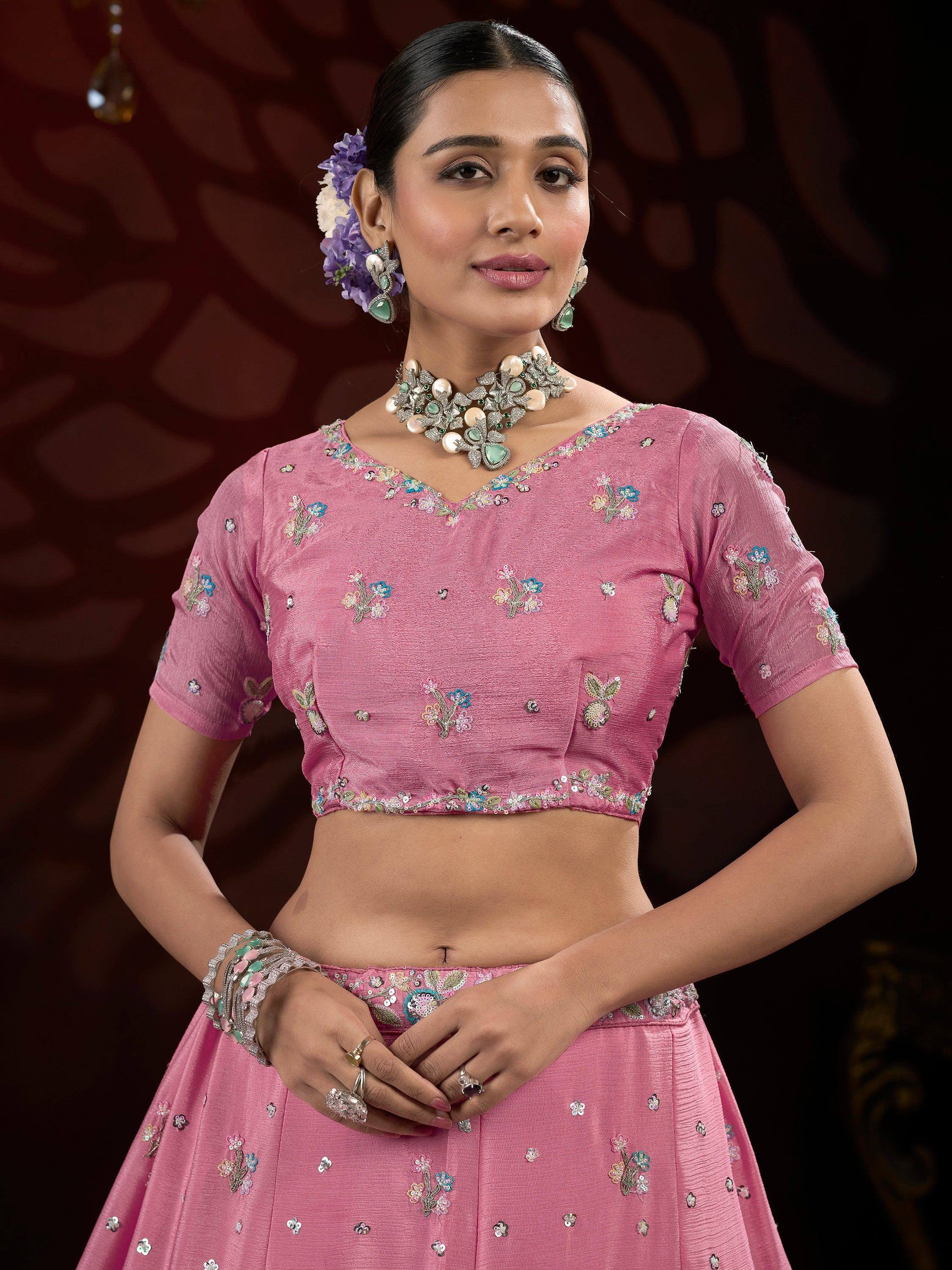 Pink floral embroidered lehenga choli with matching jewelry for Indian ethnic wear