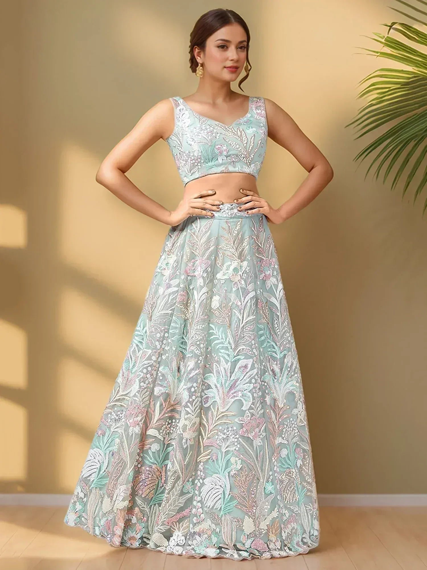 Mint green embroidered lehenga choli with floral design, perfect for Indian ethnic wear occasions.