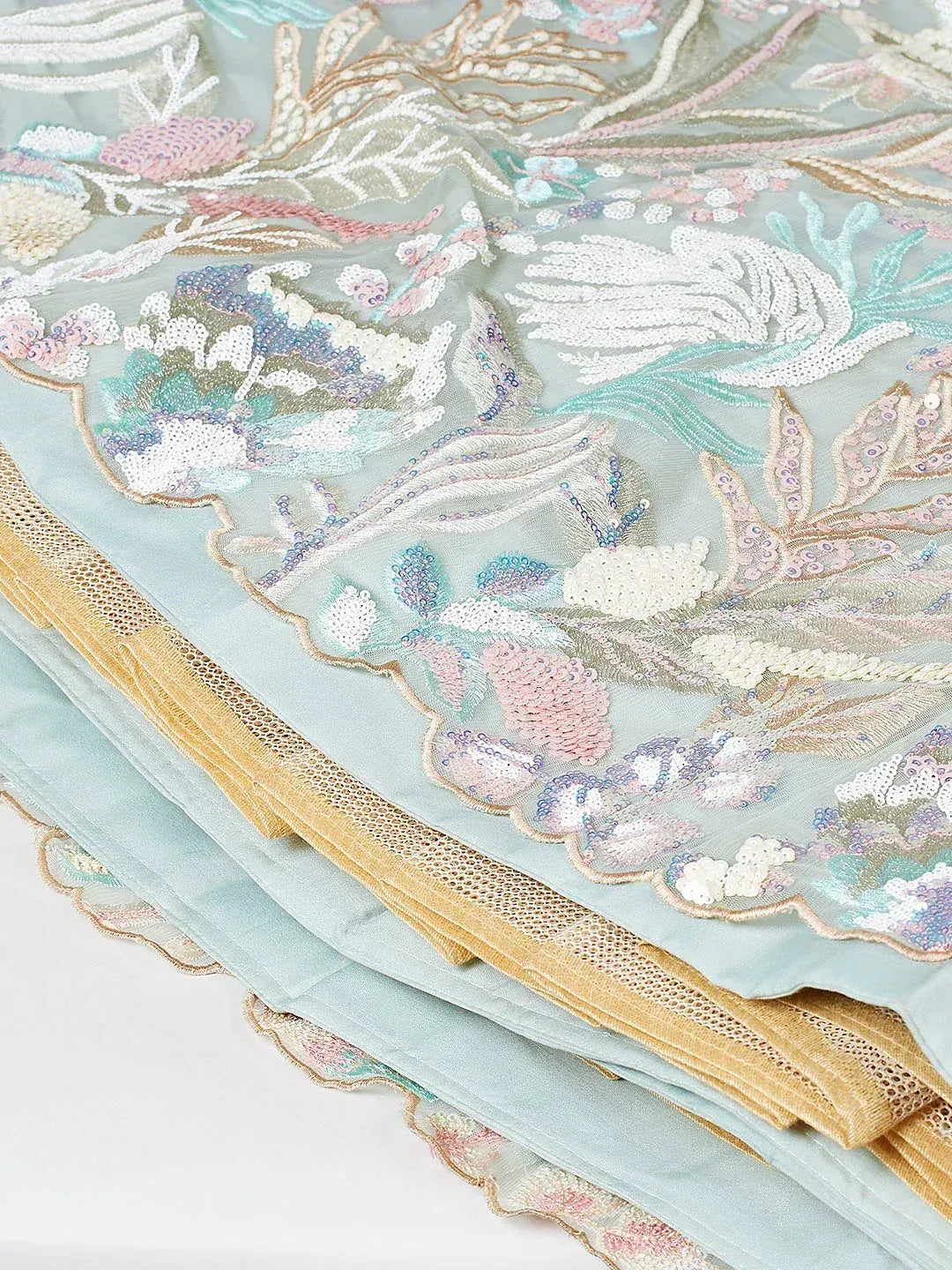 Pastel blue ethnic saree with floral embroidery and sequin detailing, gold lace border