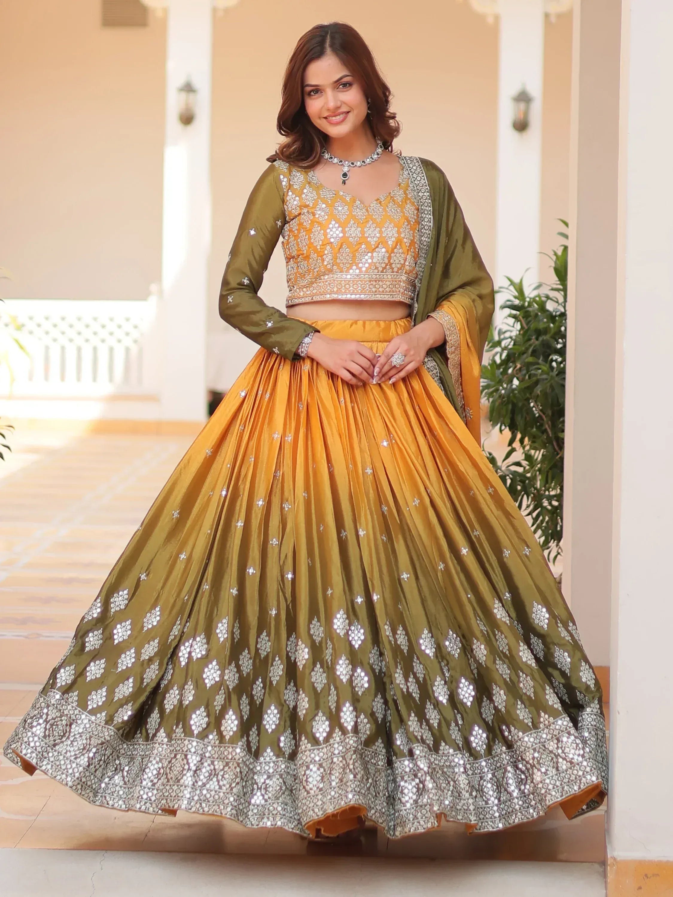 Mustard and olive green designer lehenga choli with mirror work, perfect for Indian ethnic wear events