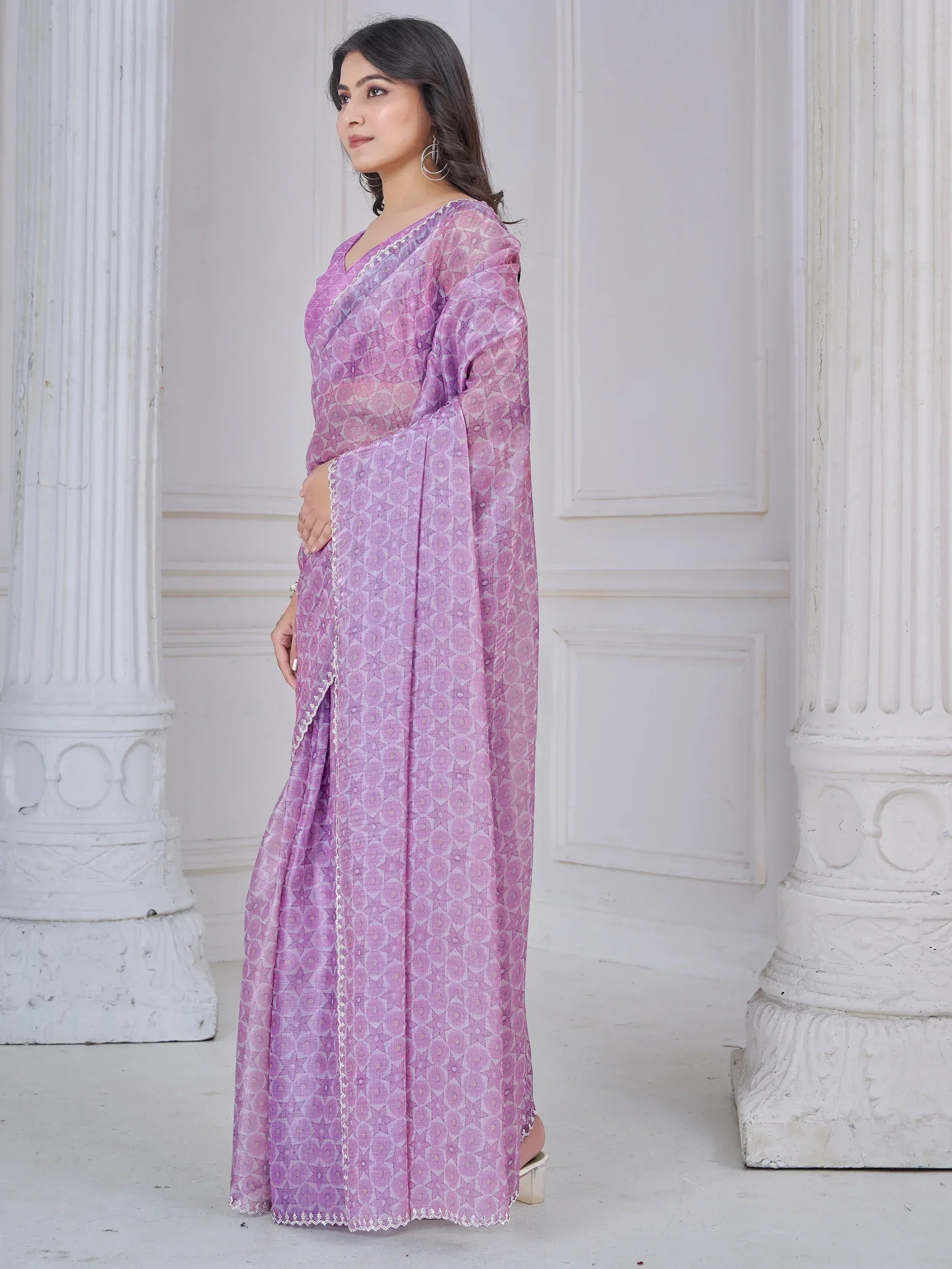 Purple printed ethnic gown with lace trim, styled for Indian occasions
