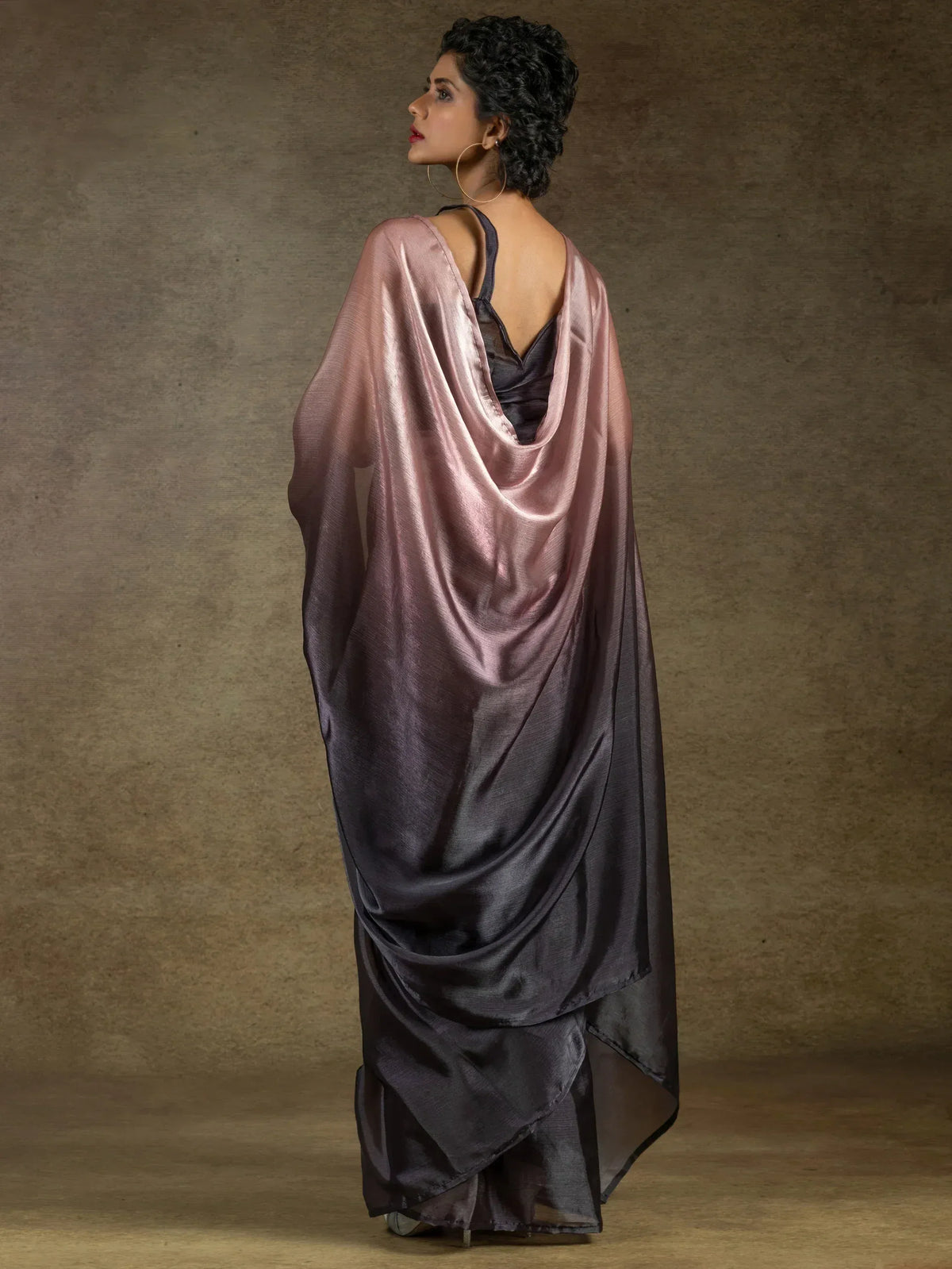 Elegant satin saree in ombre pink to grey, draped with open back blouse for Indian ethnic wear