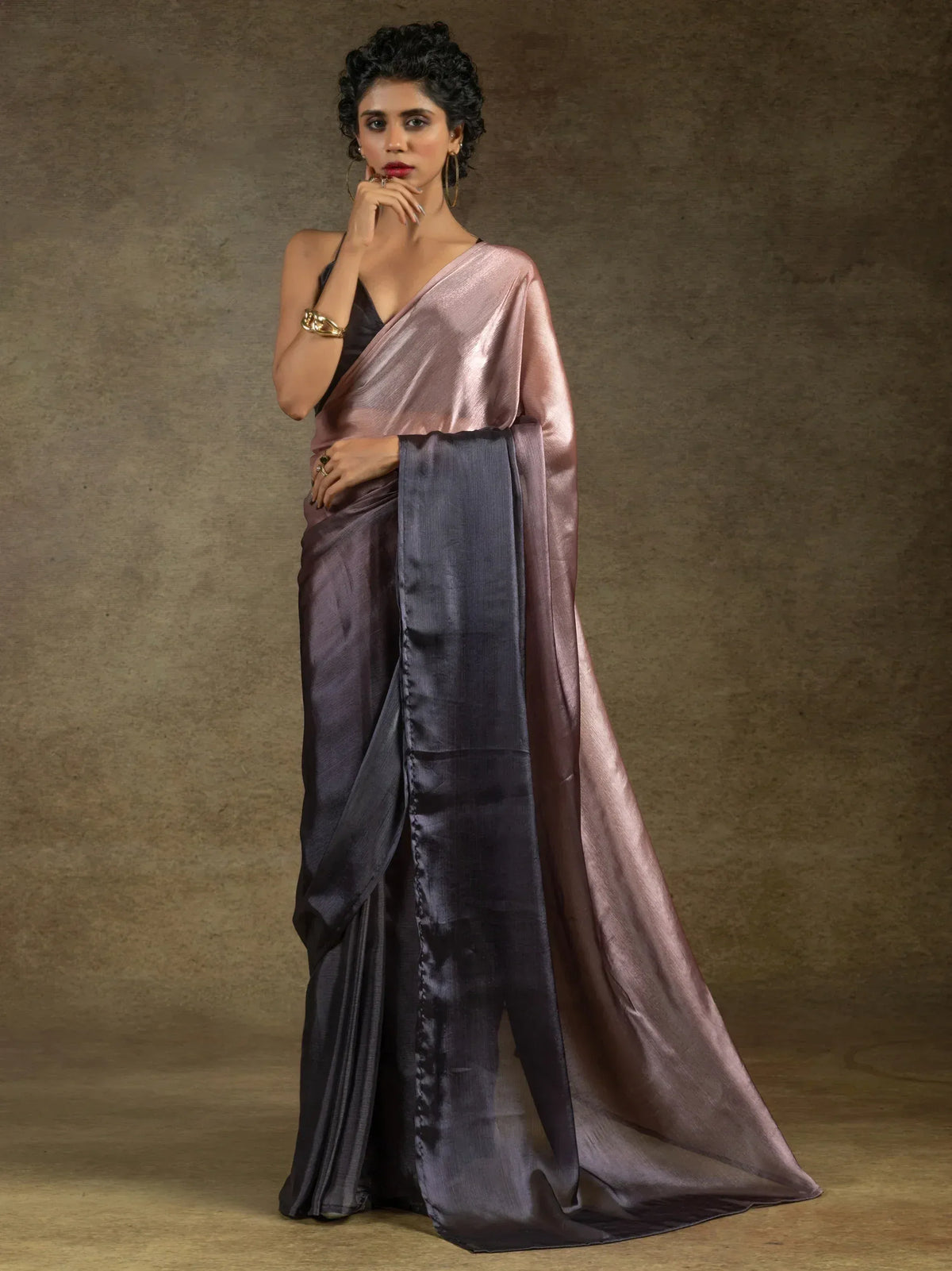 Elegant two-tone satin saree in mauve and grey, styled with black blouse for Indian ethnic wear.