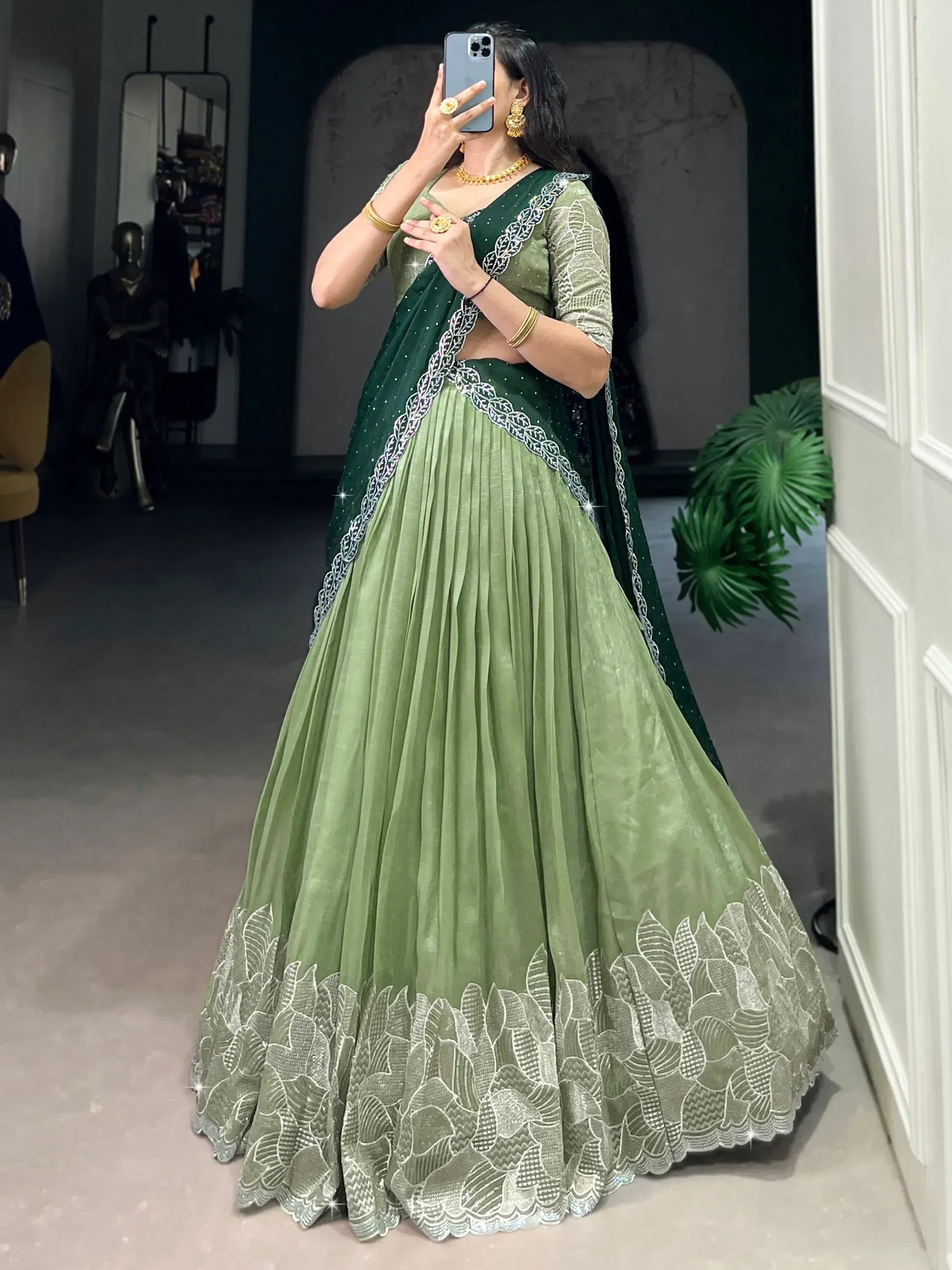 Green designer lehenga choli with silver embroidery, perfect for Indian ethnic wear occasions