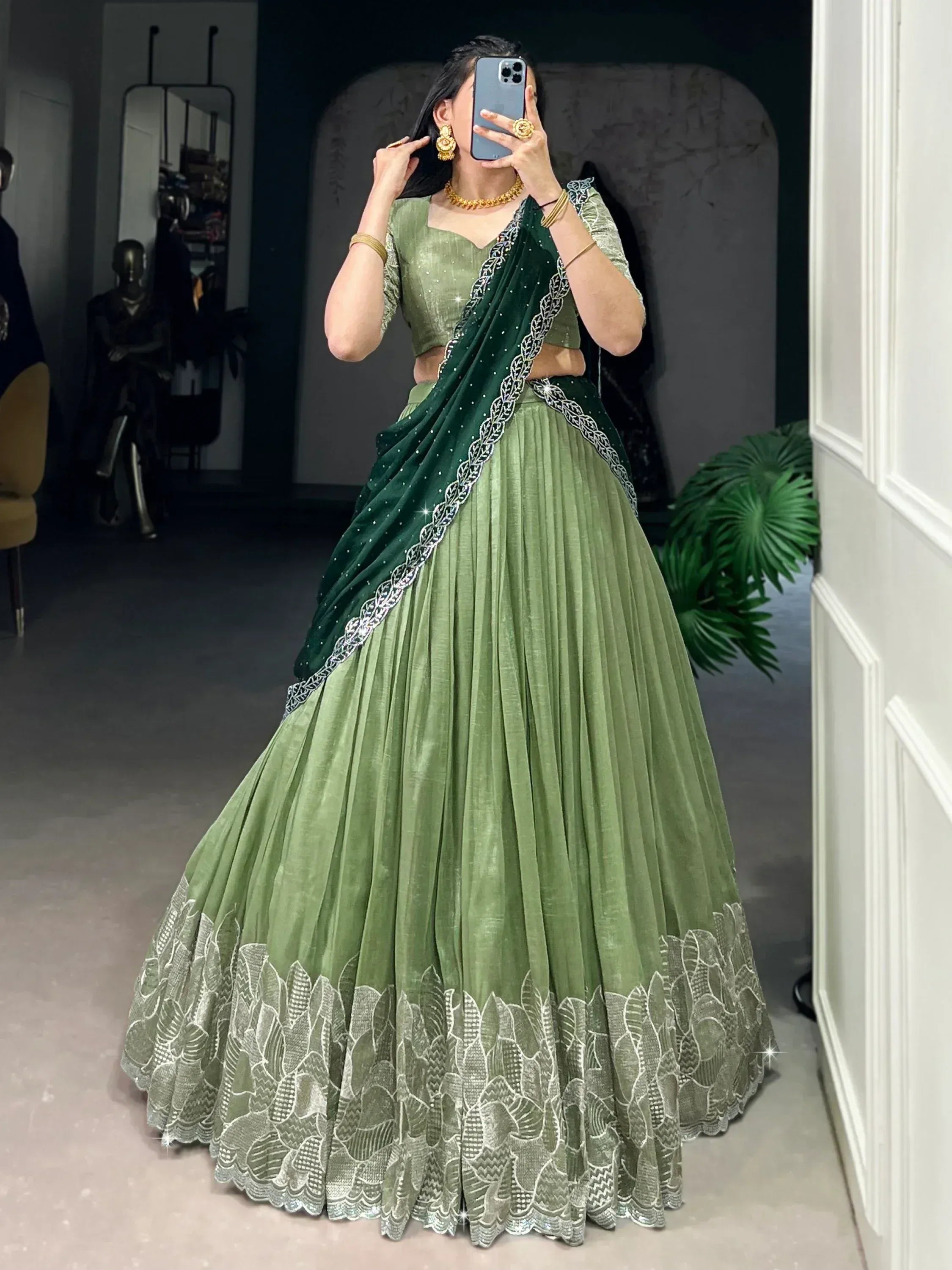 Green designer lehenga choli with embroidered dupatta, perfect for Indian ethnic wear events