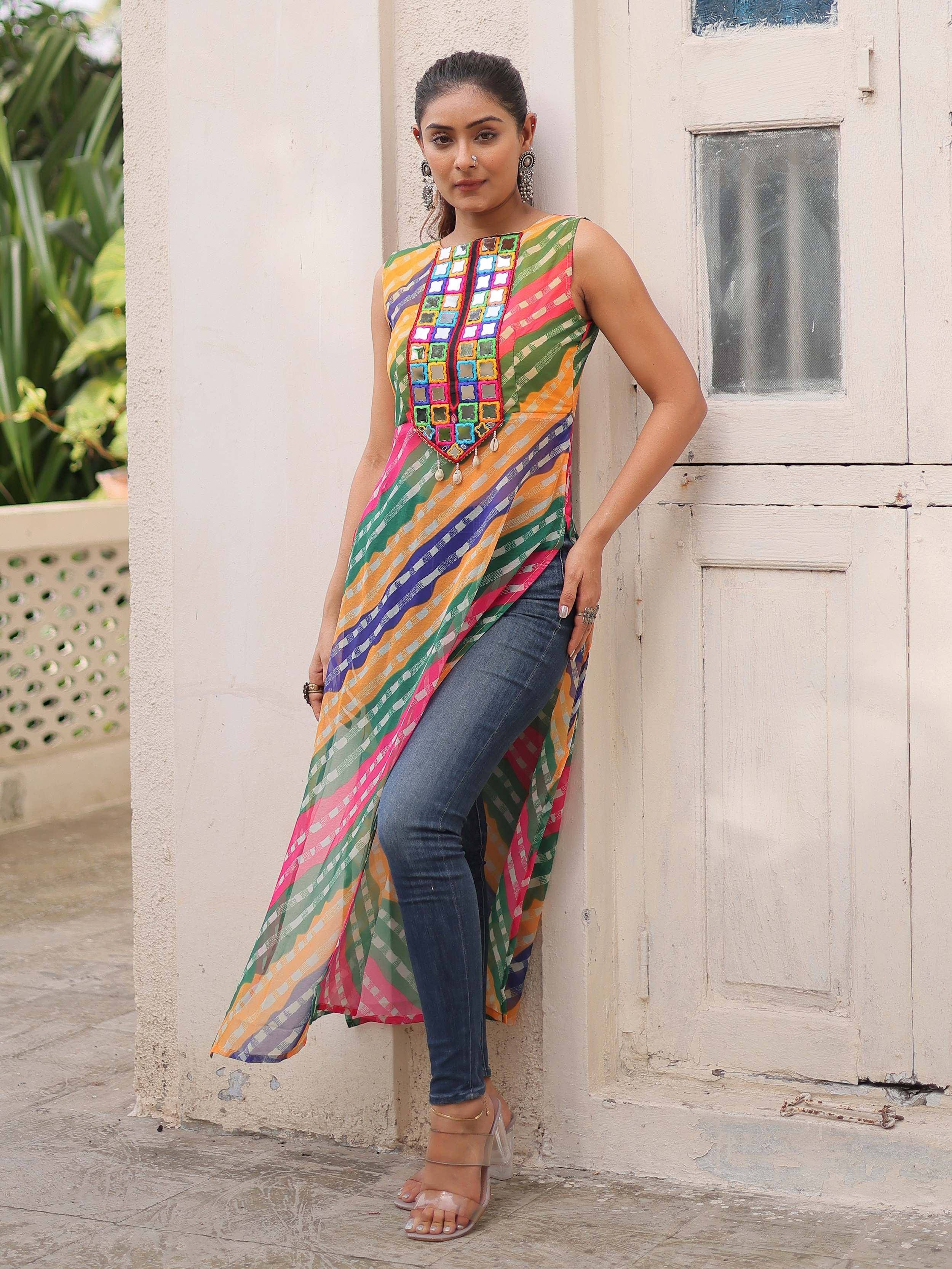 Colorful ethnic kurti with mirror work, paired with jeans, perfect for casual Indian wear