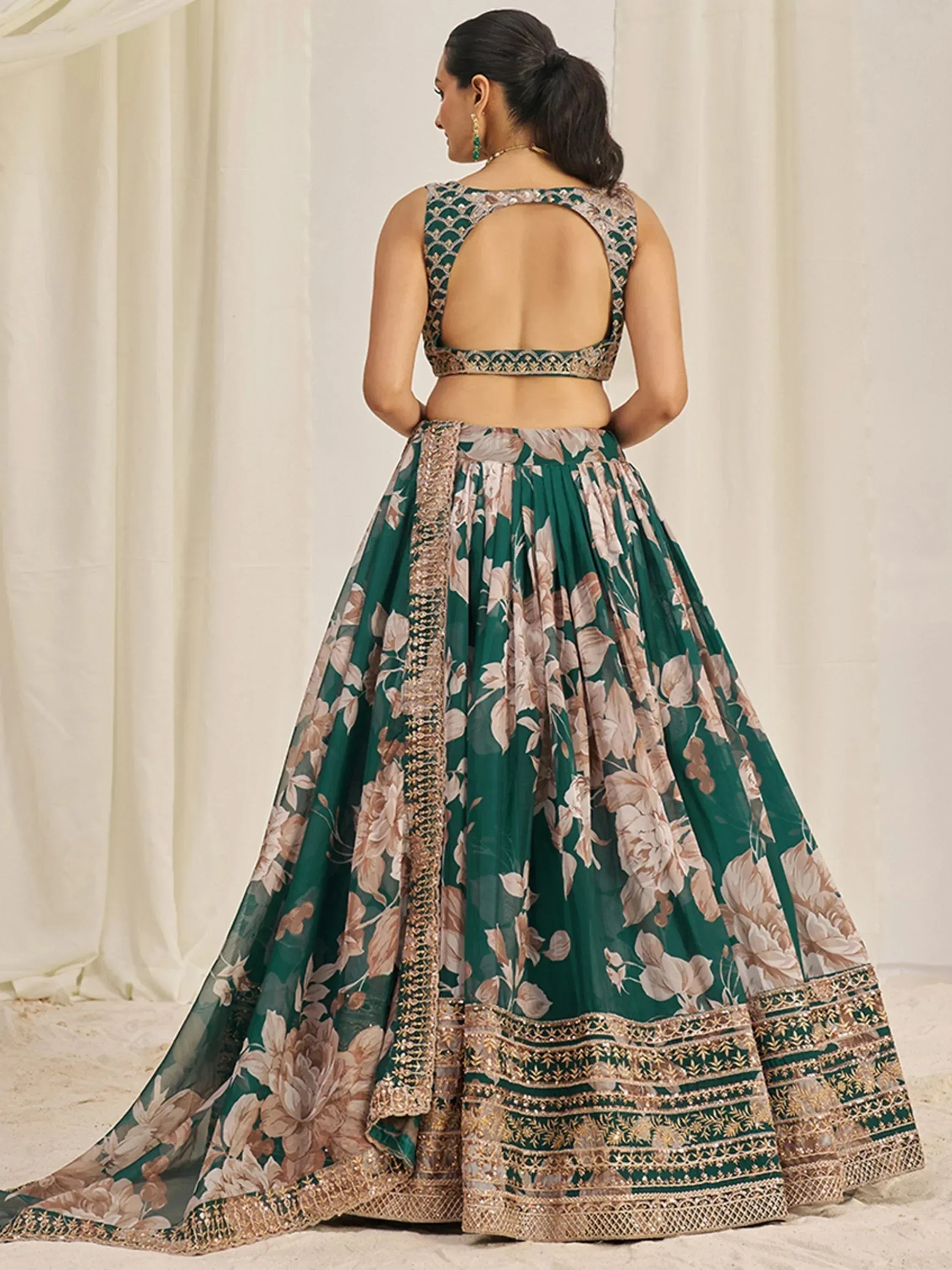 Emerald green floral lehenga choli with gold embroidery and backless blouse, Indian ethnic wear