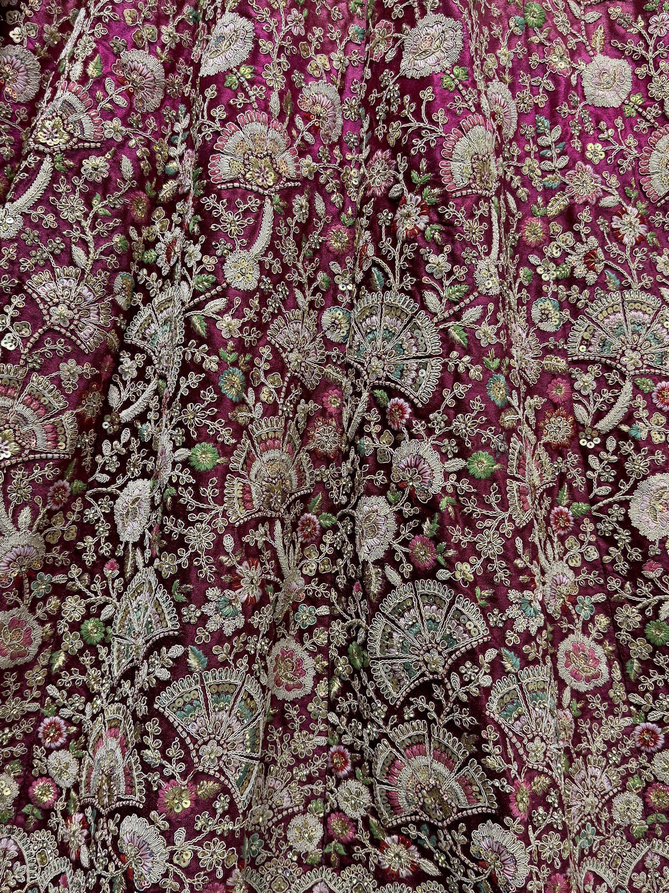 Rich maroon ethnic fabric with intricate floral embroidery and sequins for designer lehenga or saree