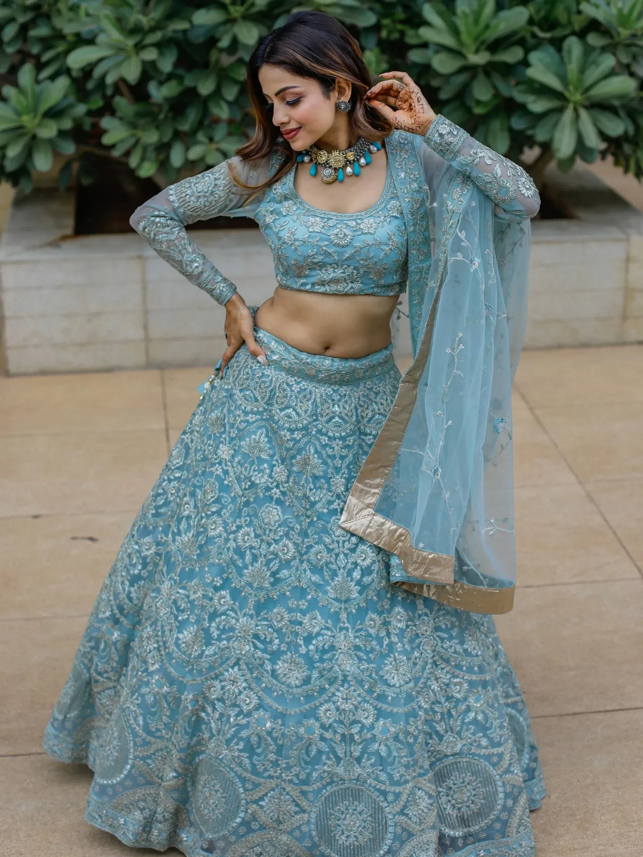 Light blue embroidered lehenga choli with sheer dupatta, perfect for Indian ethnic occasions