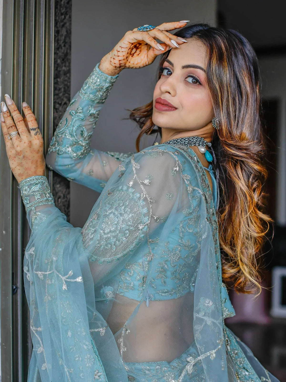 Elegant blue embroidered lehenga choli with sheer dupatta, perfect for Indian ethnic wear occasions.