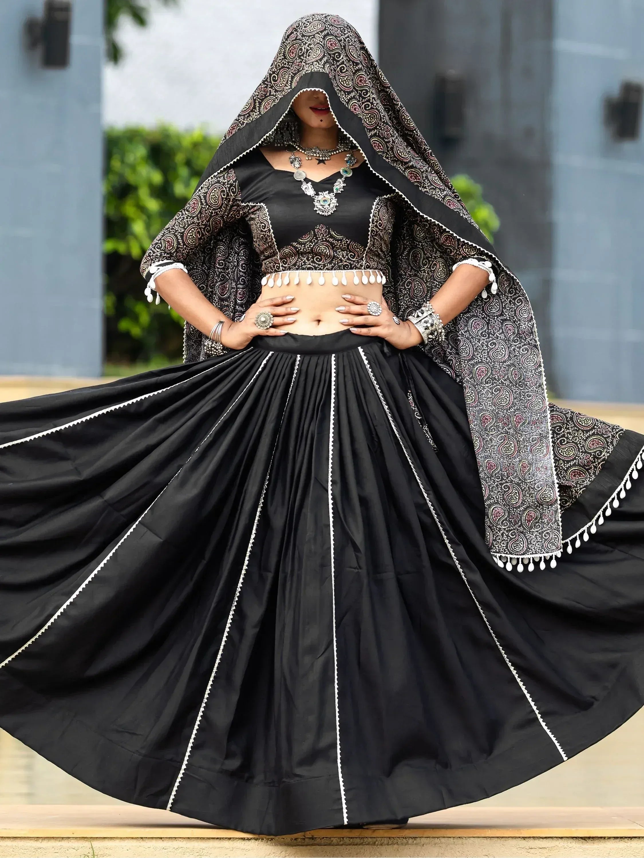 Black ethnic lehenga choli with paisley dupatta, perfect for Indian weddings and festive occasions.