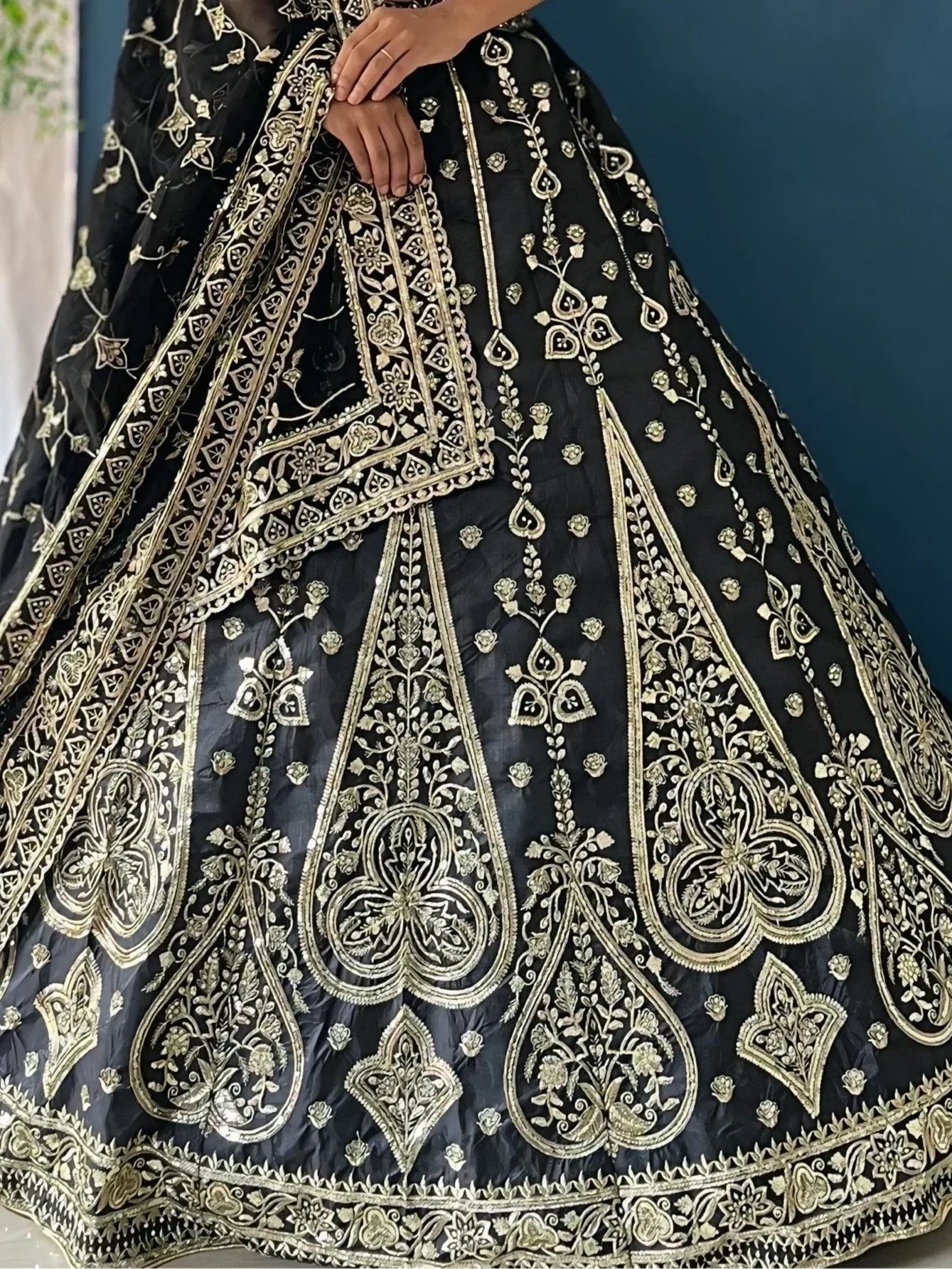 Black lehenga with gold floral embroidery, designer ethnic wear for weddings