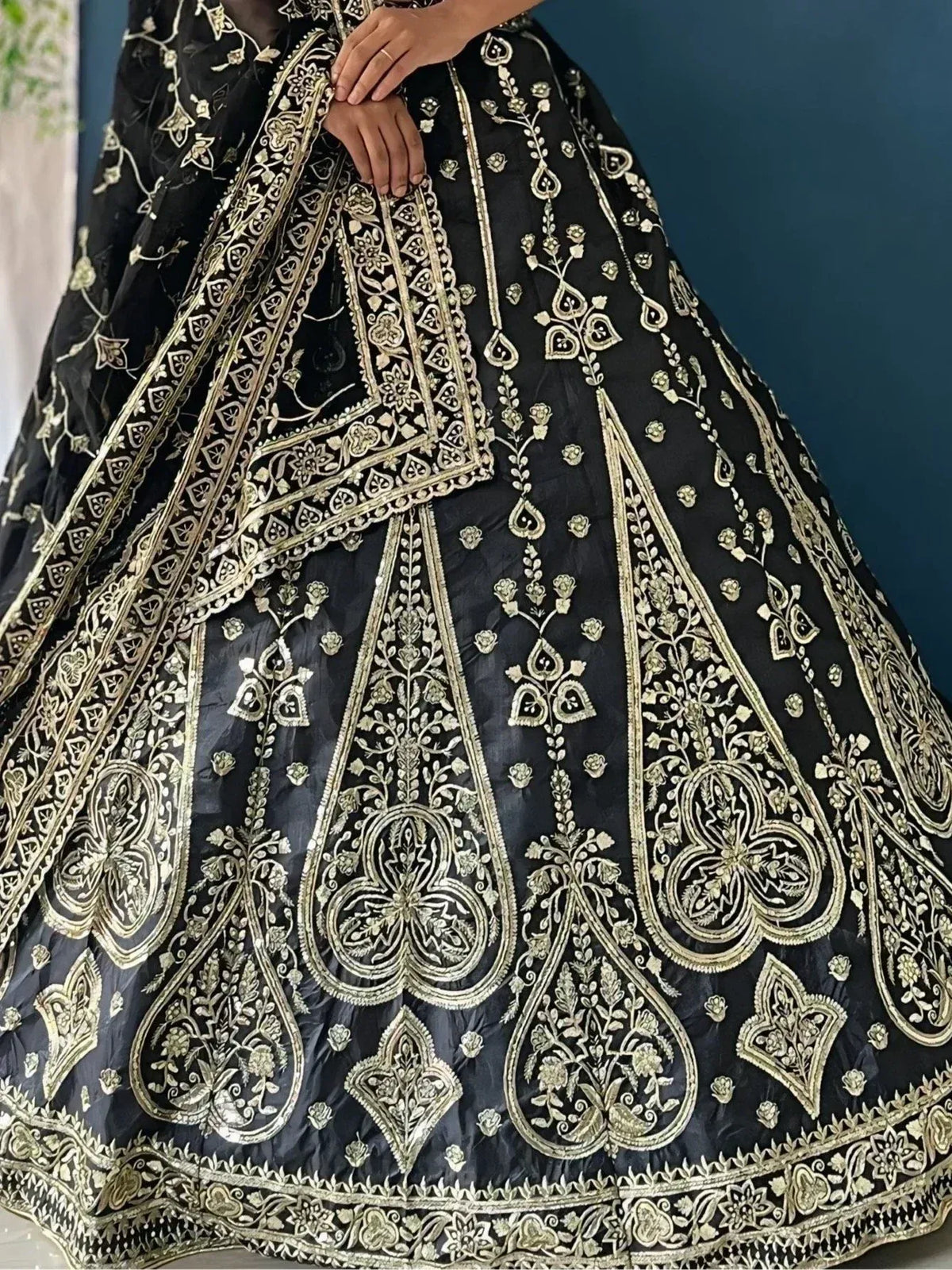 Black lehenga with gold floral embroidery, designer ethnic wear for weddings
