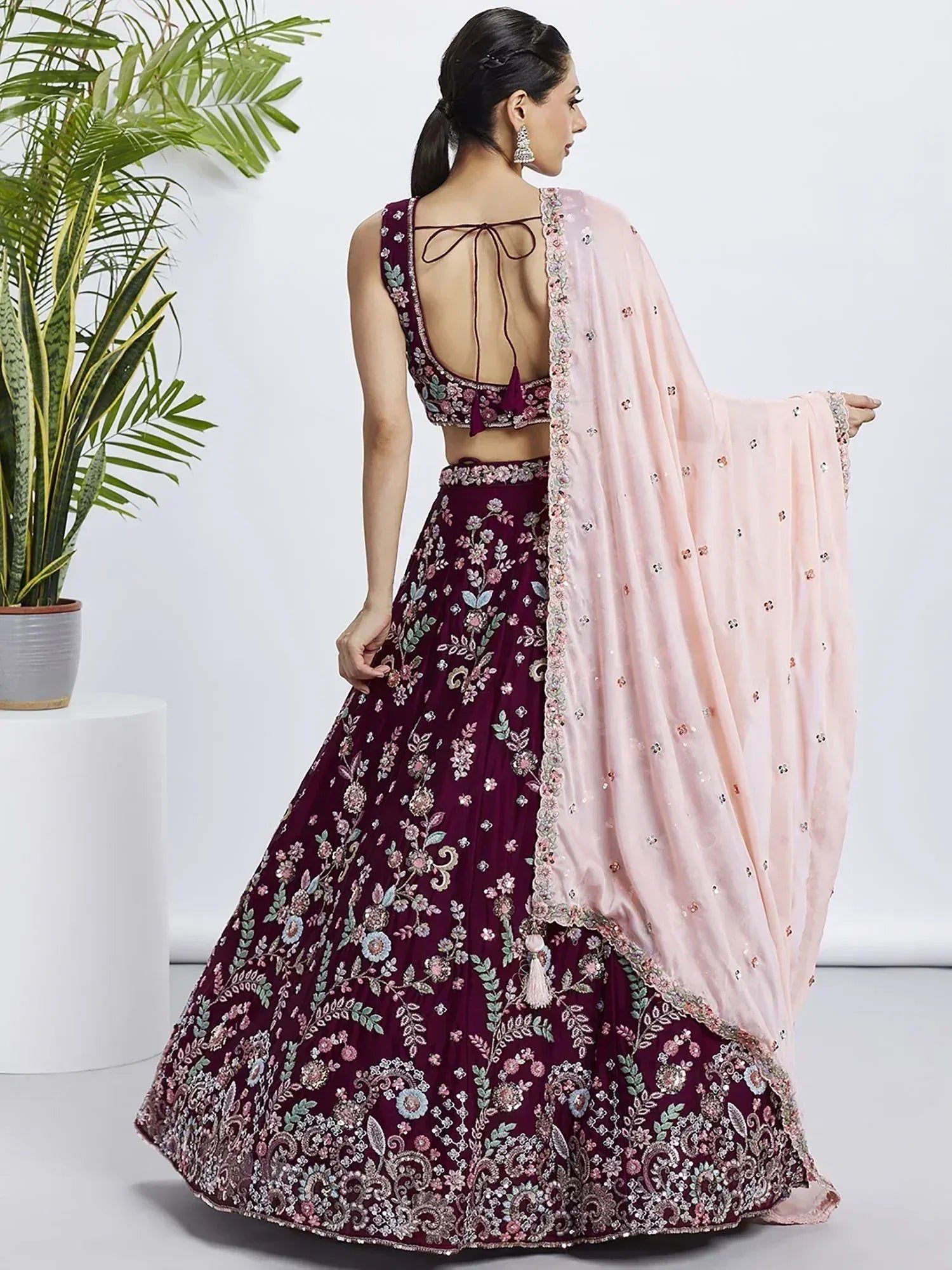Maroon floral embroidered lehenga choli with pink dupatta, back view, Indian ethnic wear