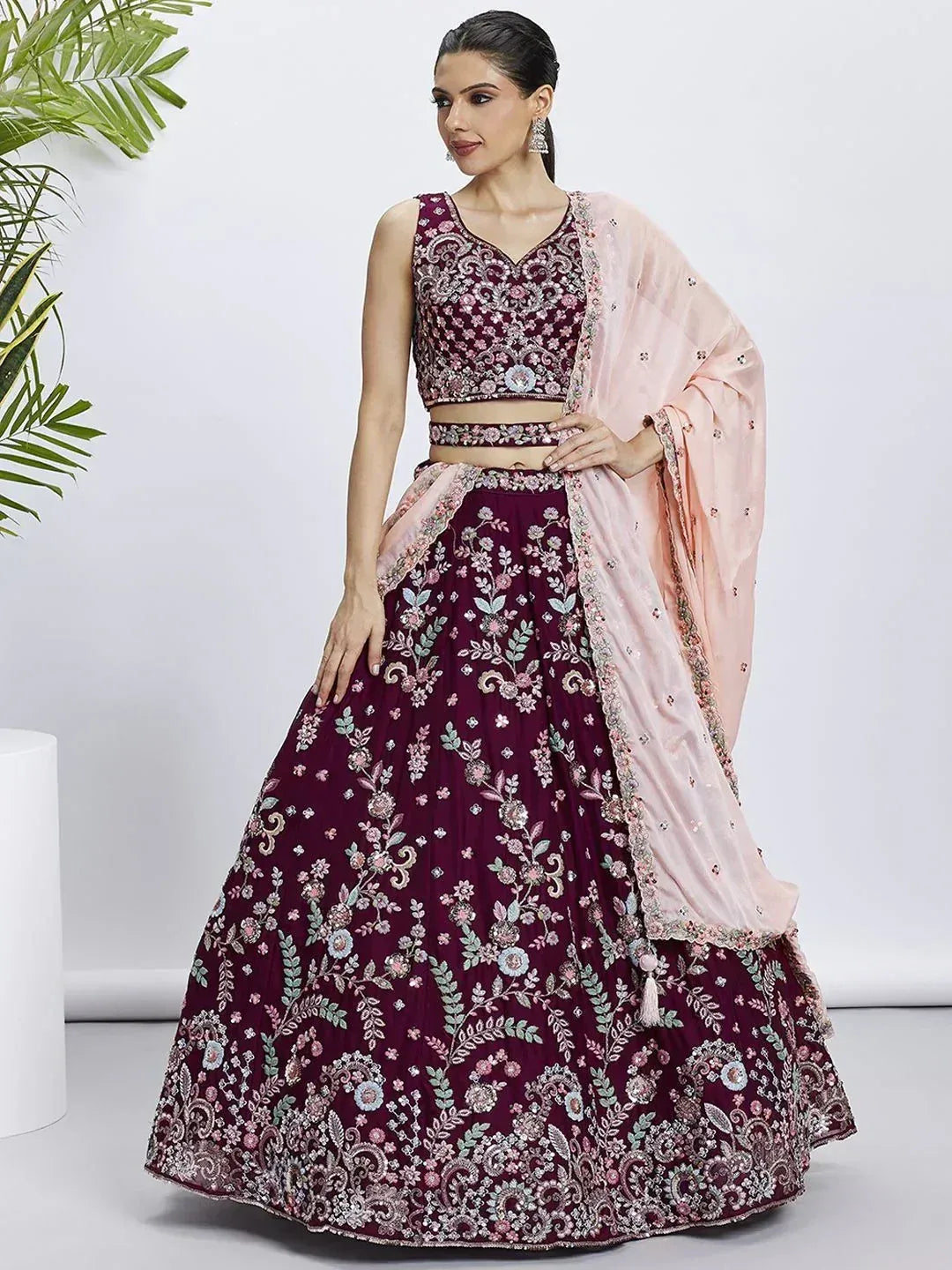 Elegant maroon lehenga choli with floral embroidery and pink dupatta, perfect for Indian ethnic occasions.