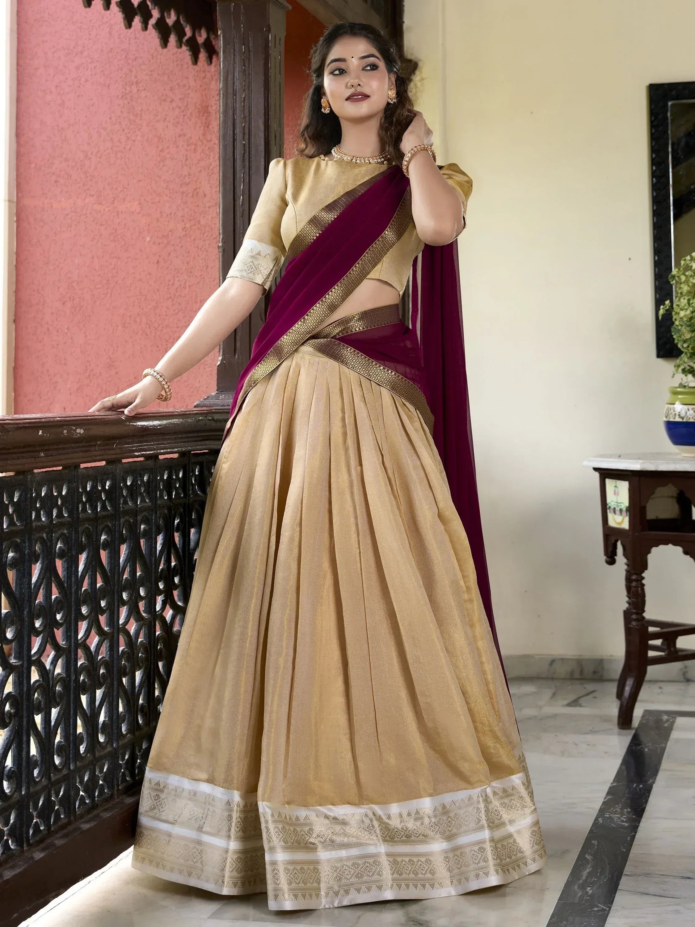 Gold lehenga choli with maroon dupatta, ethnic Indian wear for weddings and festivals