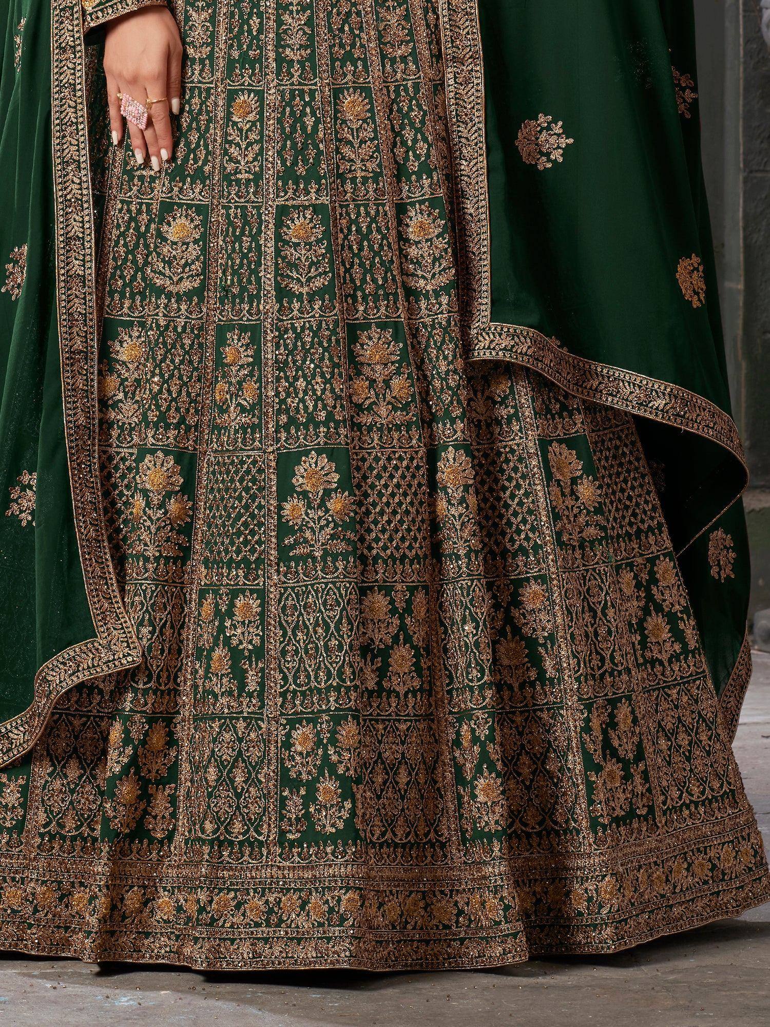 Emerald green lehenga with gold floral embroidery and intricate border detailing for Indian ethnic wear