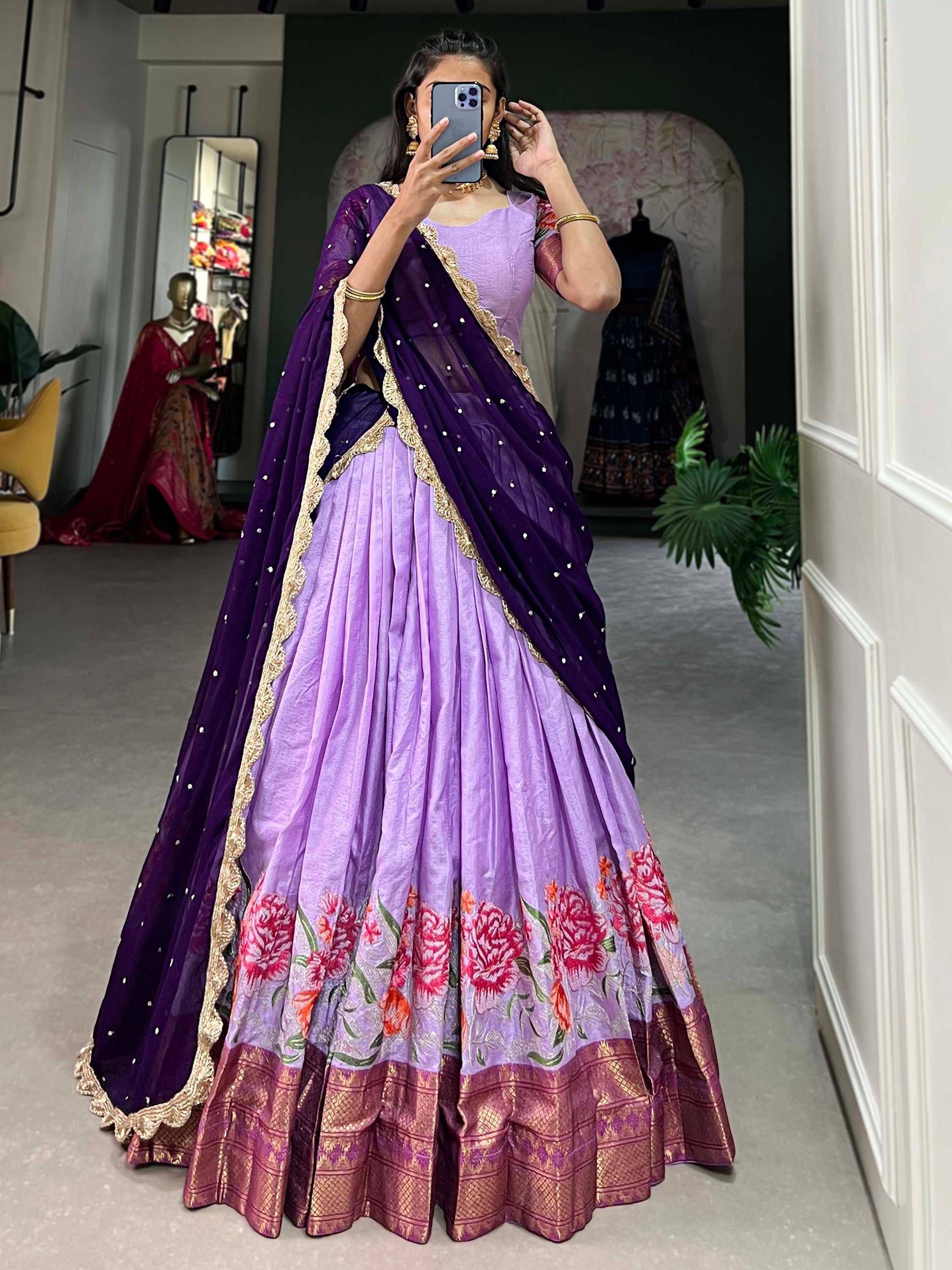 Purple and lavender lehenga choli with floral embroidery and gold border, perfect for Indian ethnic occasions.