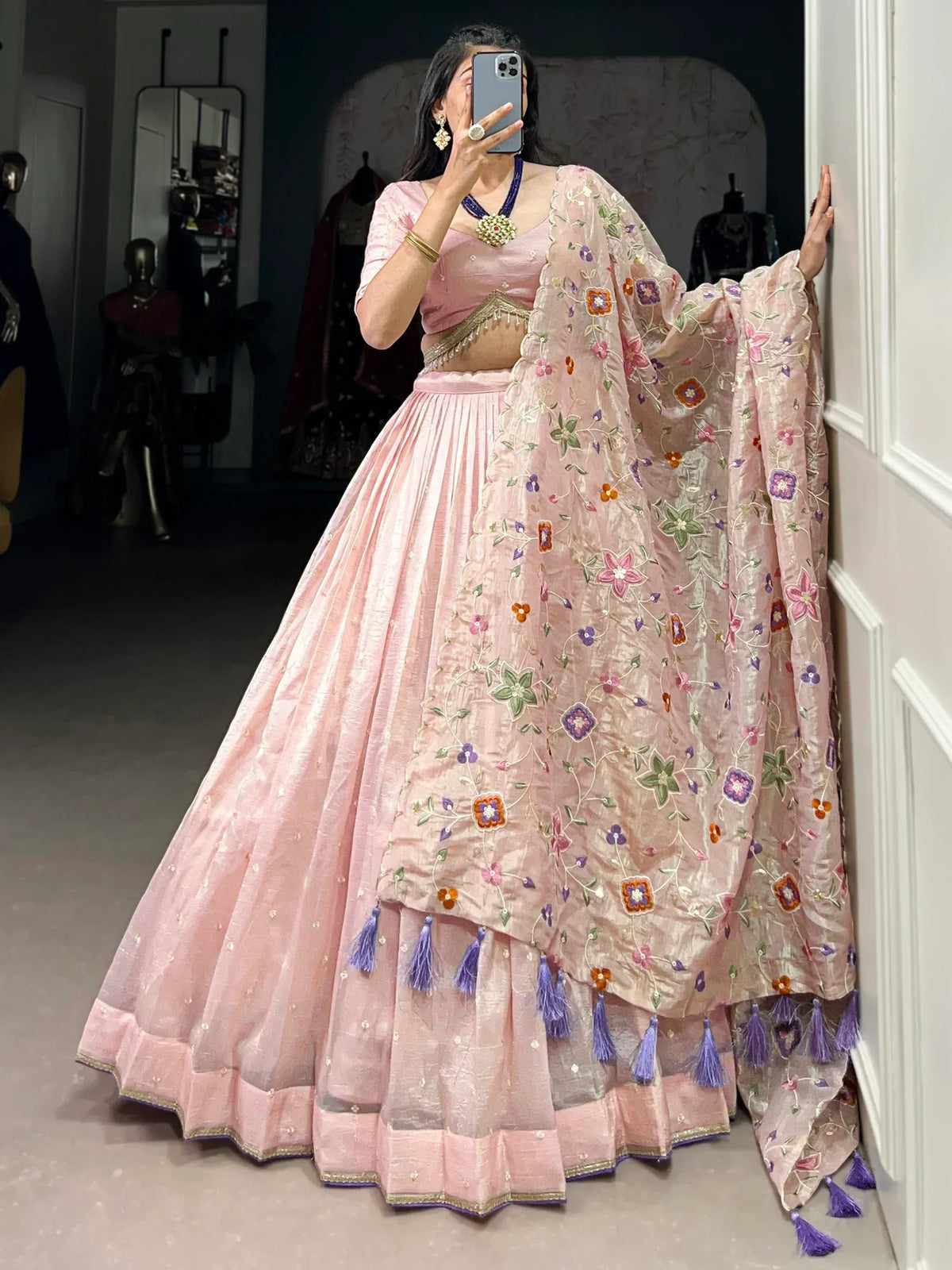 Pink floral embroidered lehenga choli with tassels, perfect for Indian ethnic wear occasions