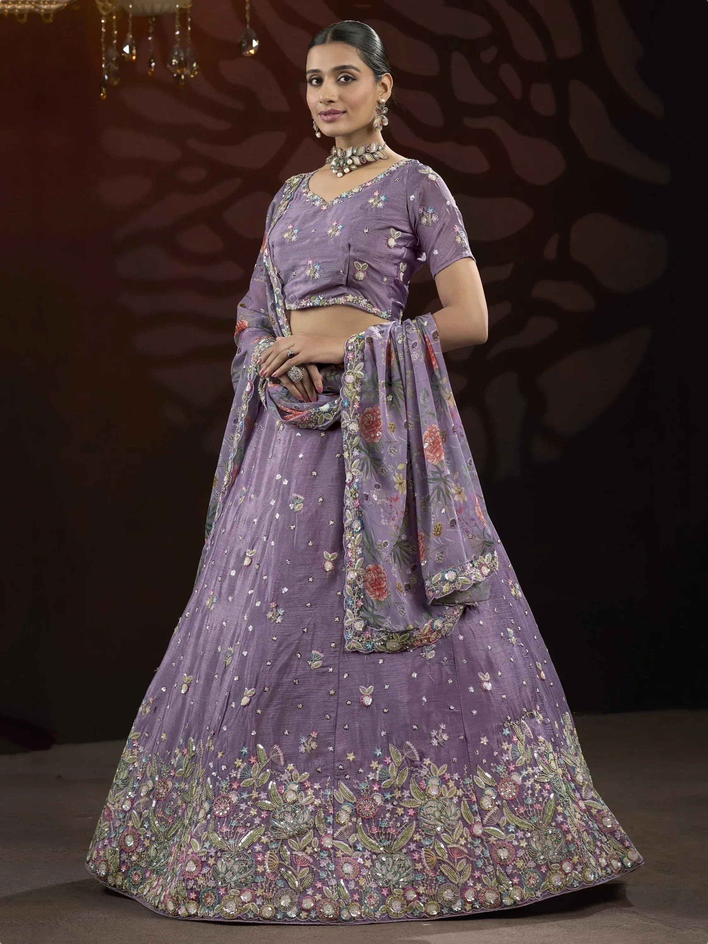 Purple floral embroidered lehenga choli with matching dupatta, perfect for Indian weddings and festive occasions.