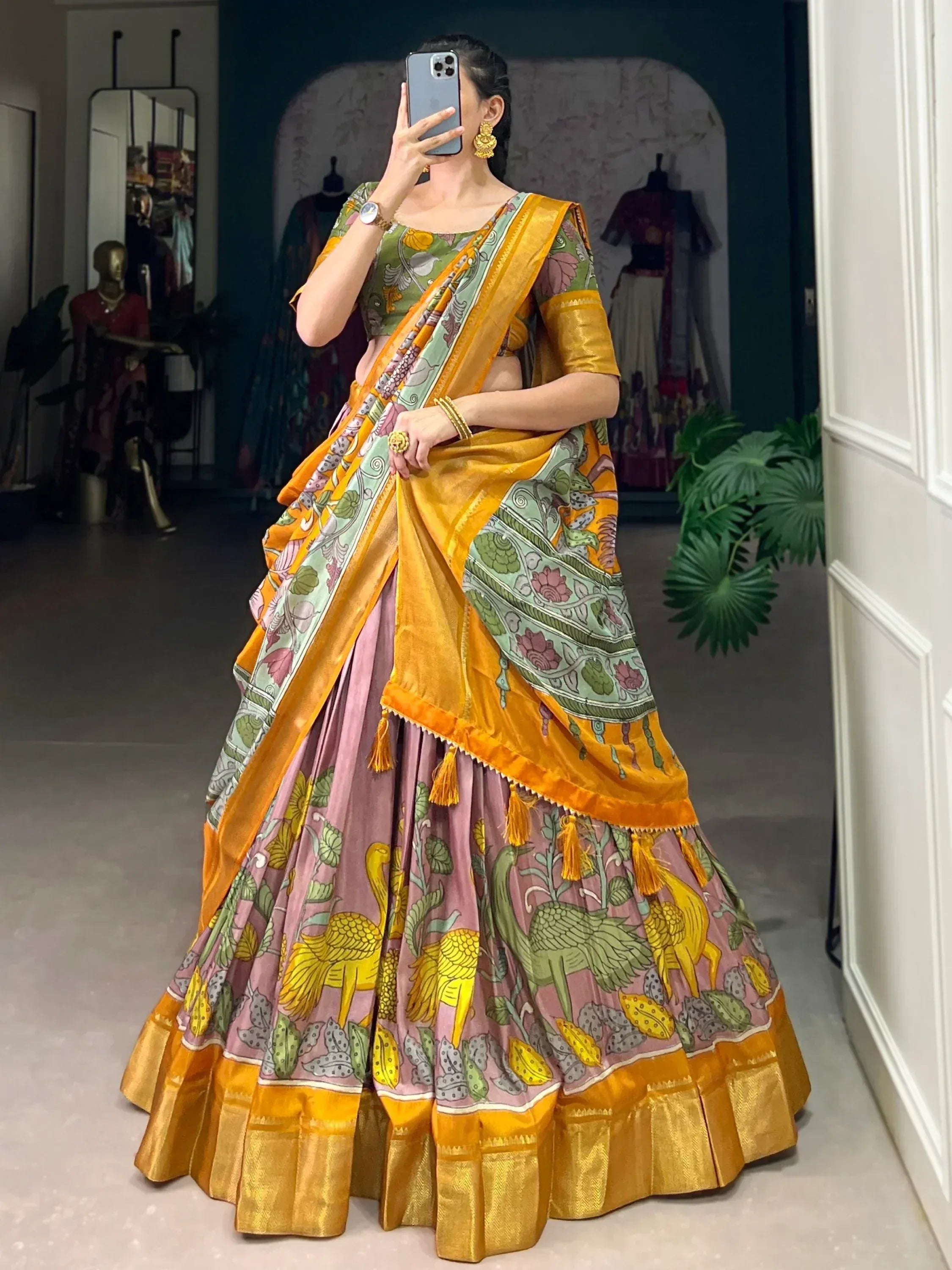 Woman in vibrant printed lehenga choli with peacock motifs, perfect for Indian ethnic wear occasions