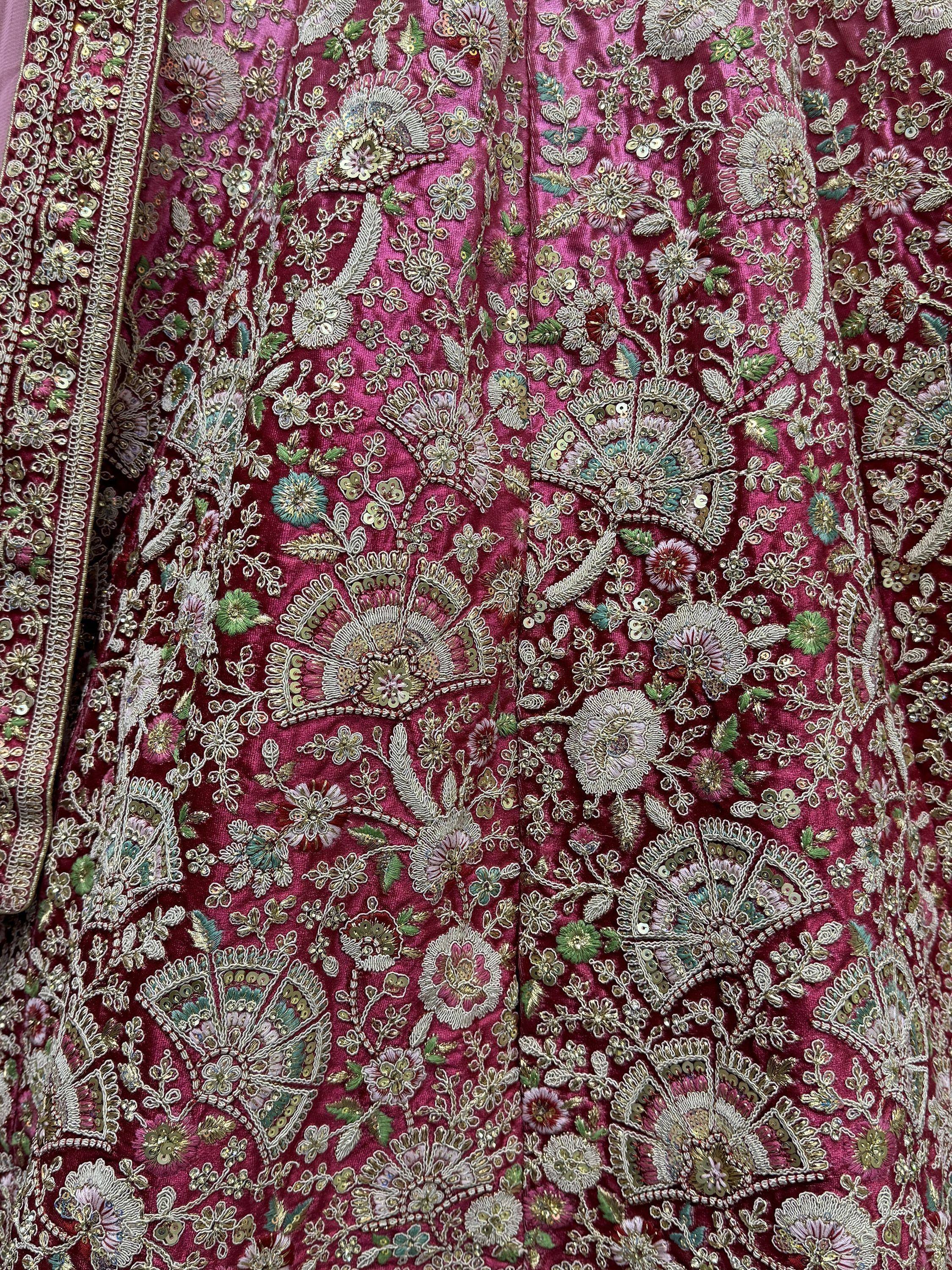 Richly embroidered magenta Indian ethnic wear with floral zari and sequin detailing