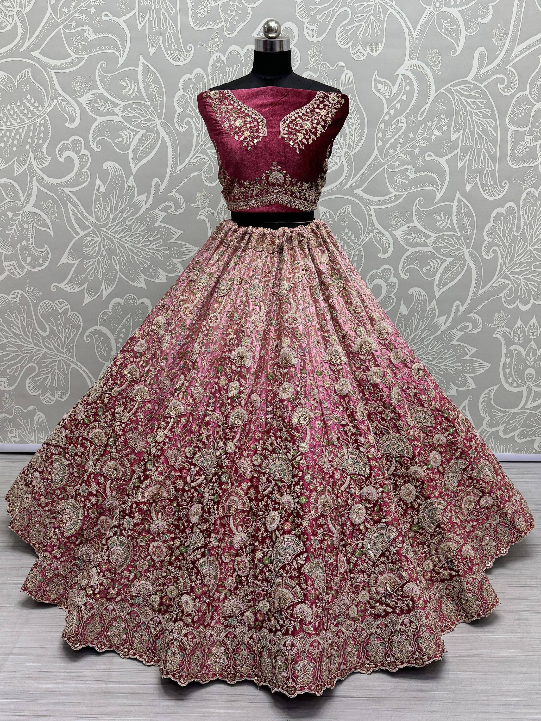 Maroon designer lehenga choli with heavy gold embroidery, perfect for Indian weddings and festive occasions