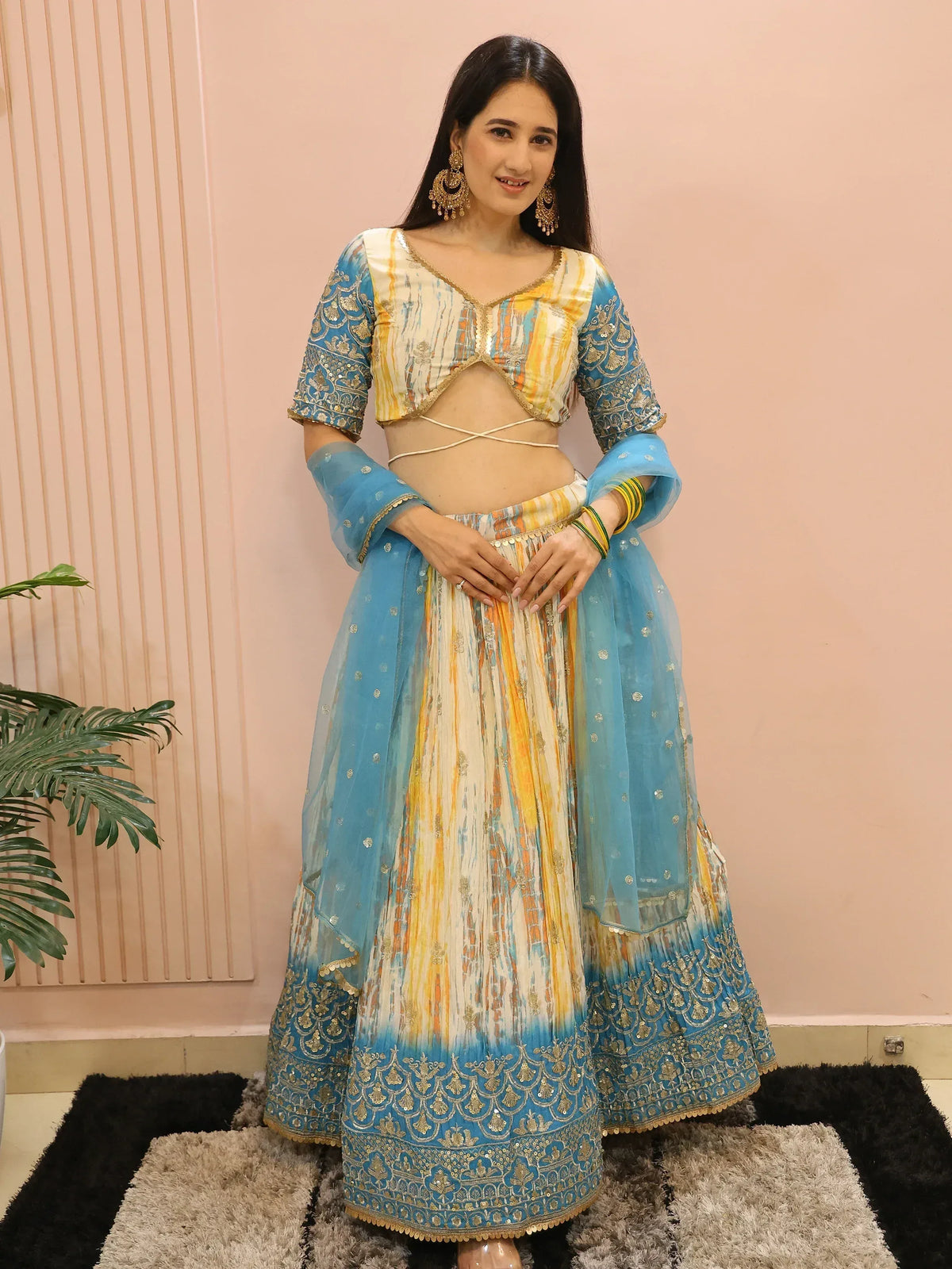 Blue and yellow designer lehenga choli with gold embroidery, perfect for Indian ethnic wear occasions