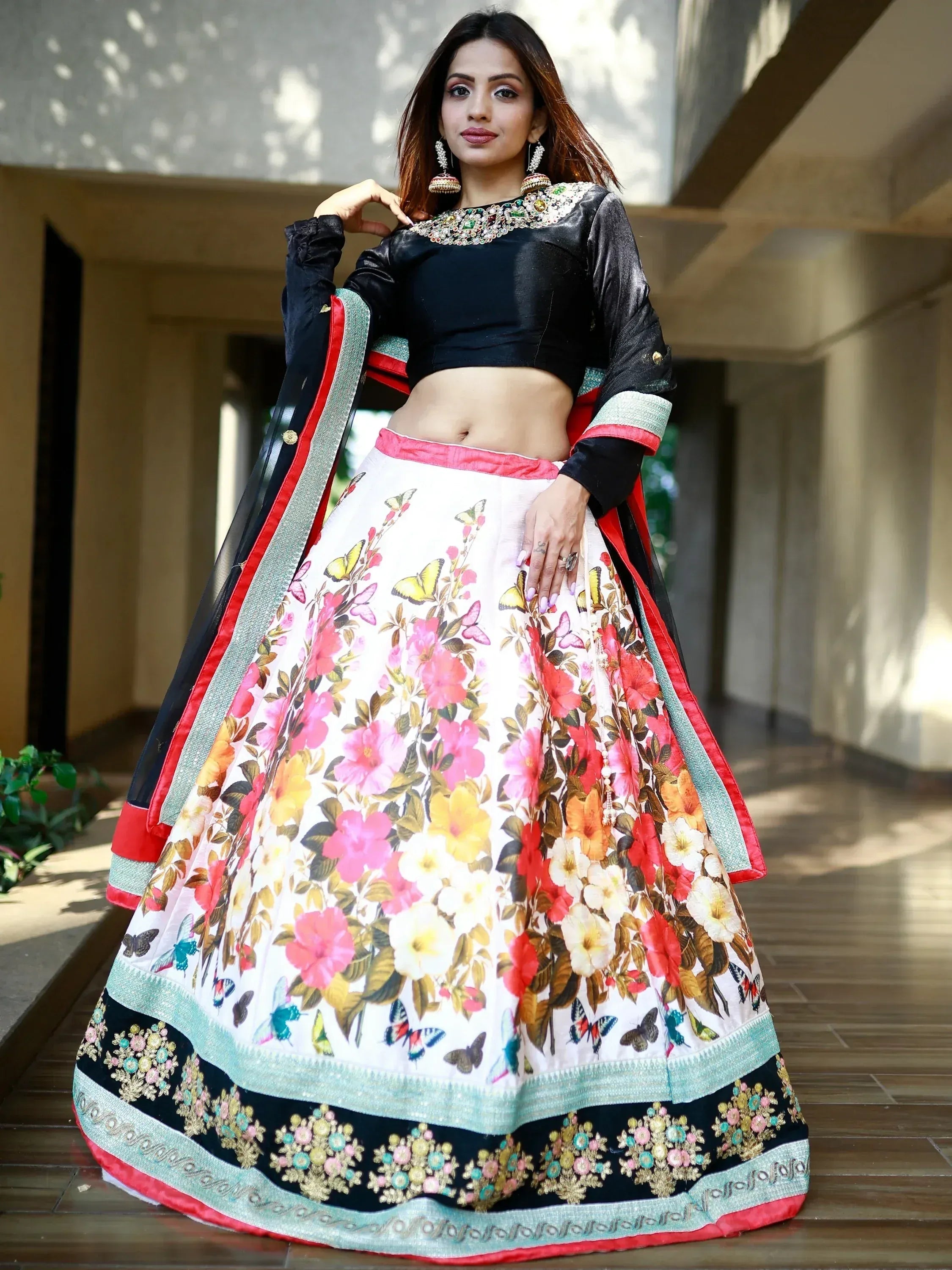 Floral print lehenga choli with black velvet blouse and embroidered border, perfect for Indian ethnic wear