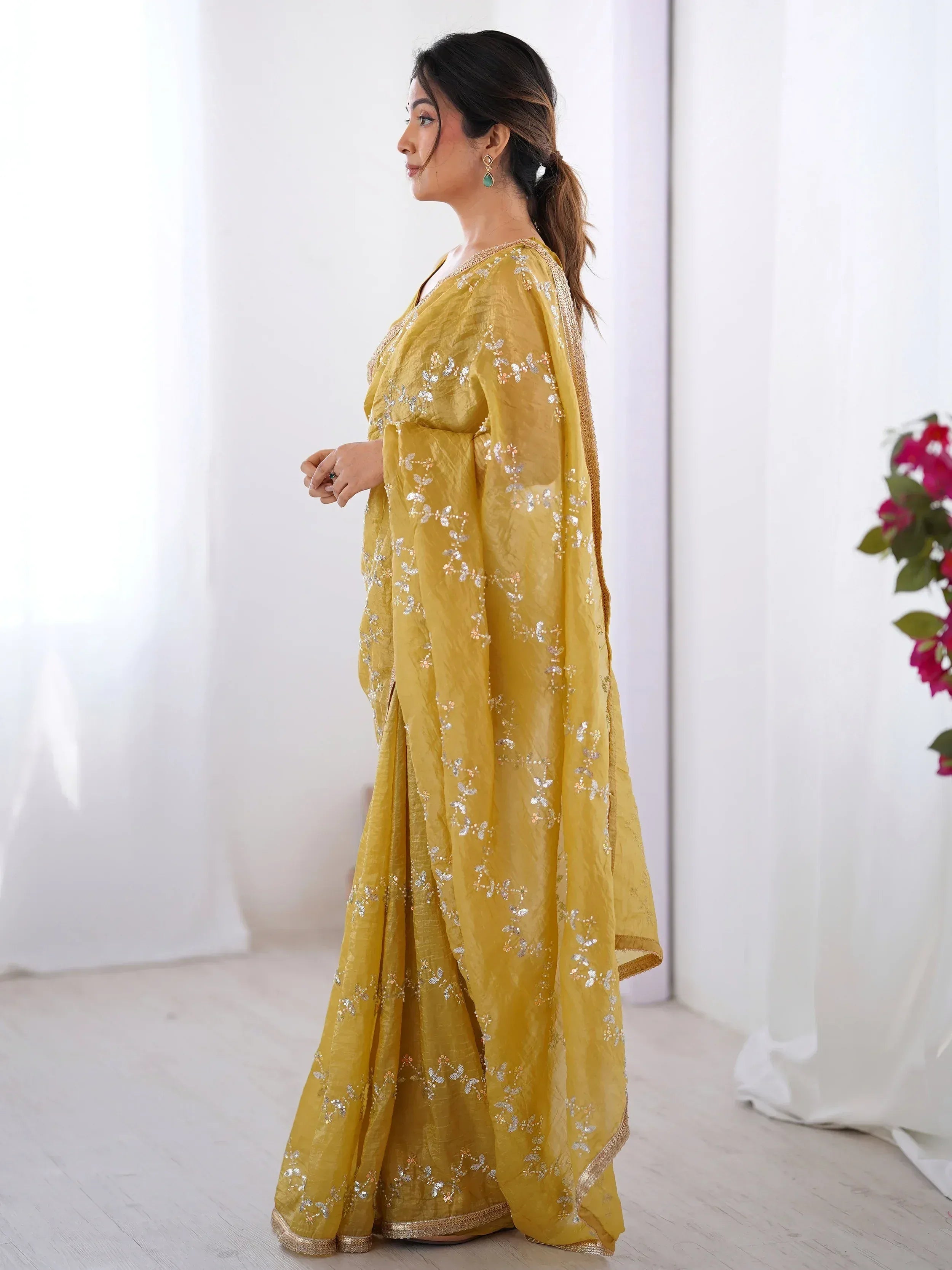 Yellow embroidered ethnic gown with sequin detailing, perfect for Indian occasions and festive wear.