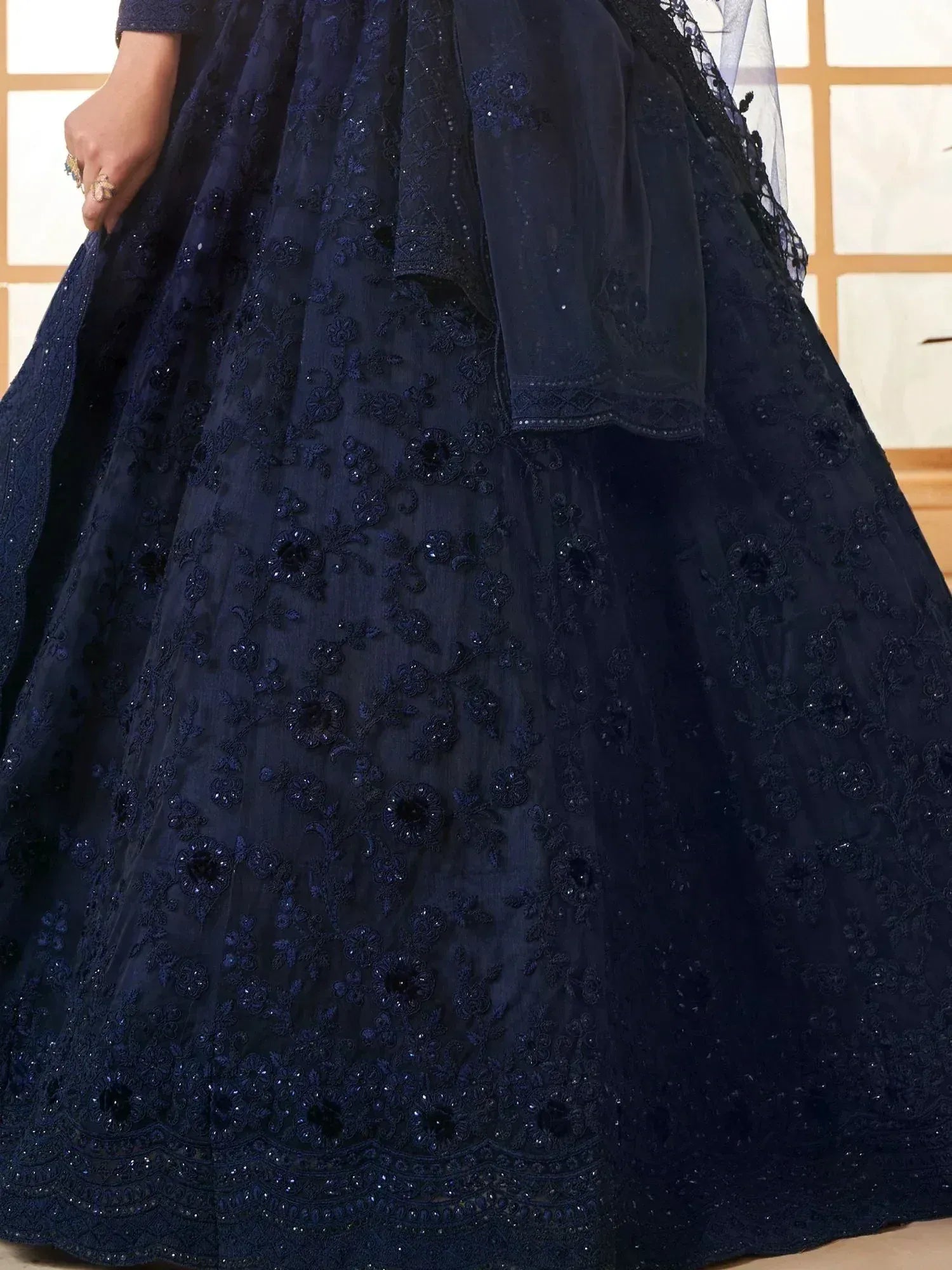 Navy blue embroidered lehenga choli with floral beadwork and sheer dupatta, ideal for Indian ethnic occasions