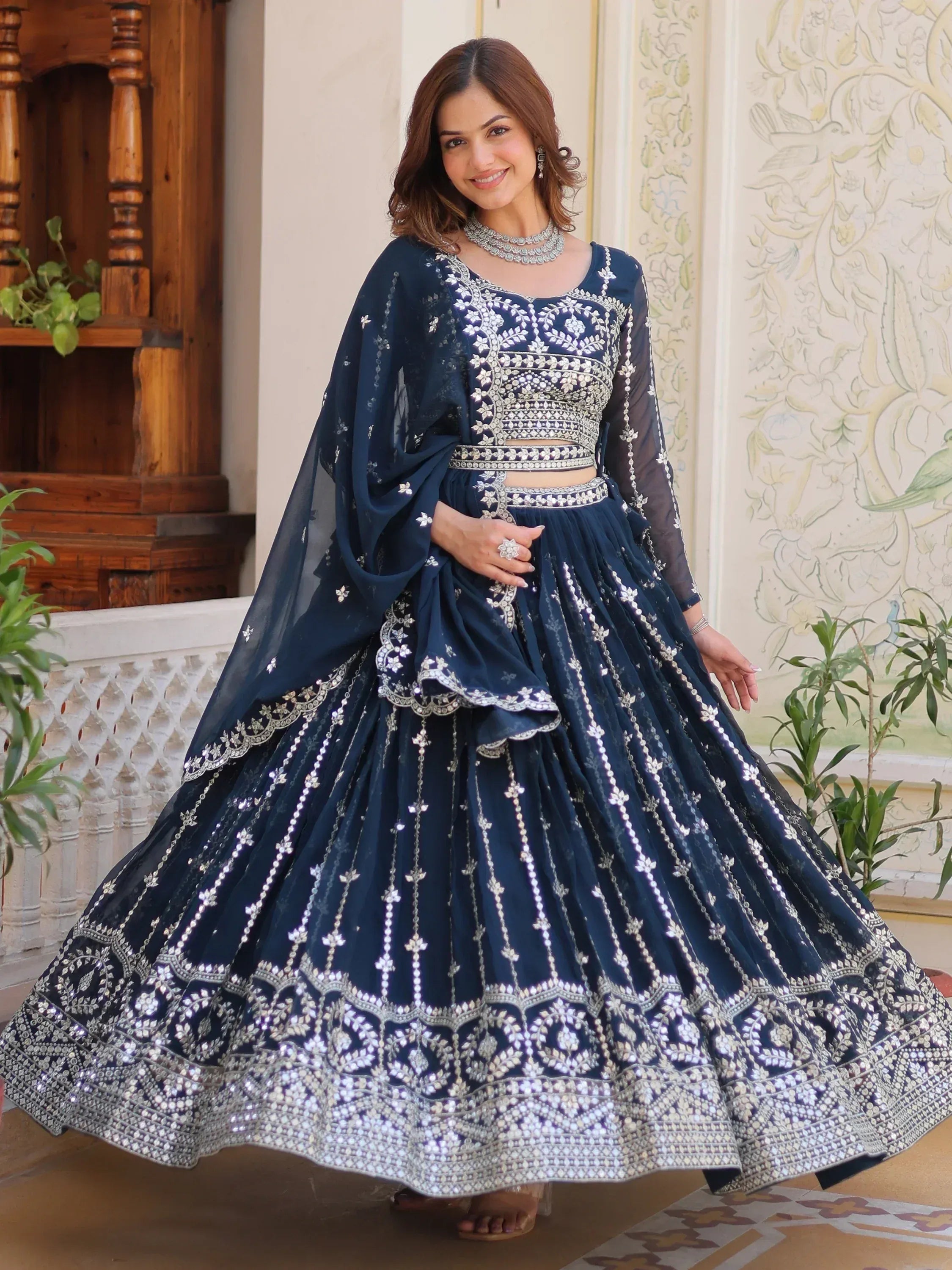 Navy blue designer lehenga choli with silver embroidery, perfect for Indian ethnic wear events