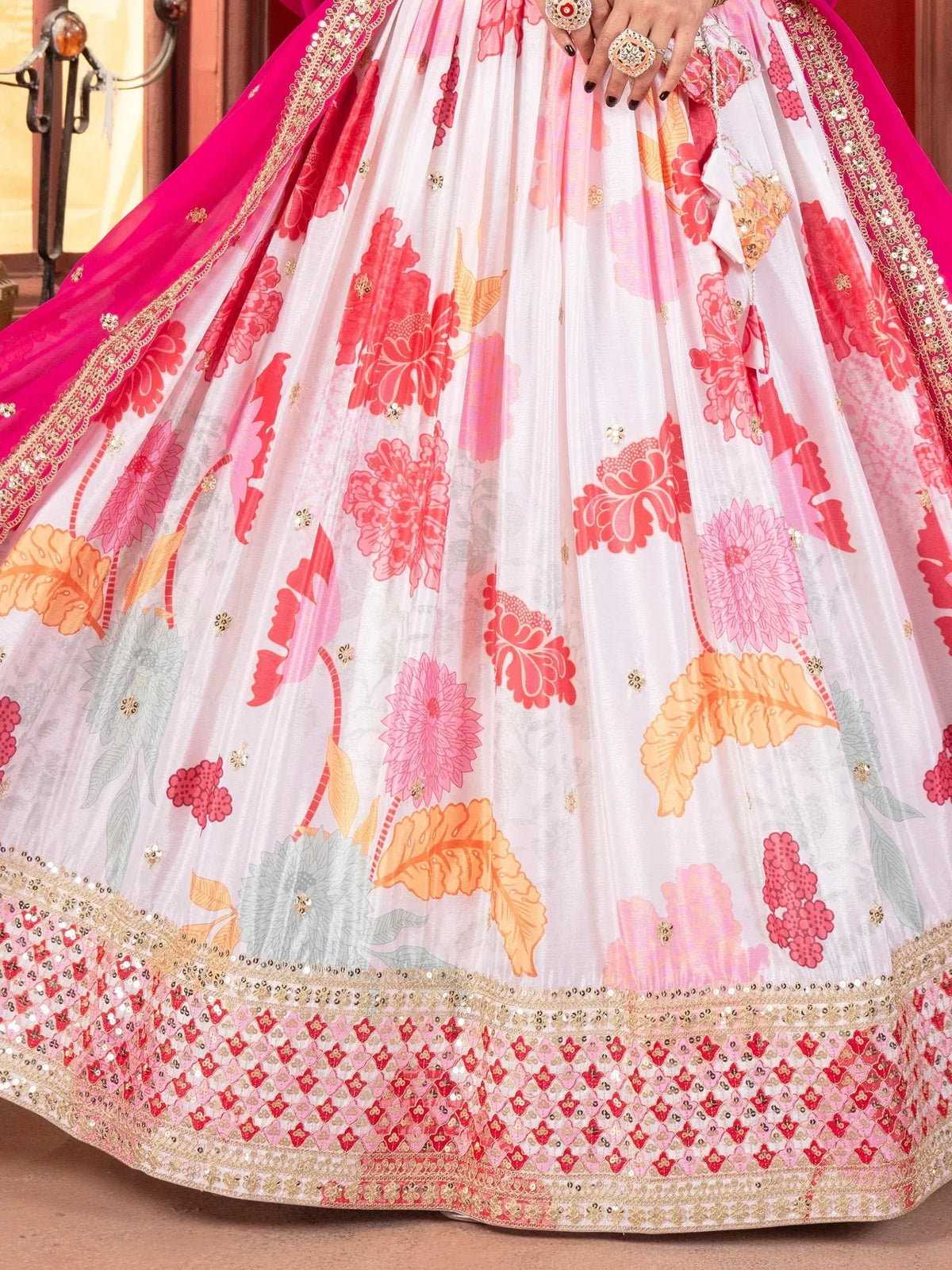 White floral lehenga with pink and gold embroidery, perfect for Indian ethnic wear