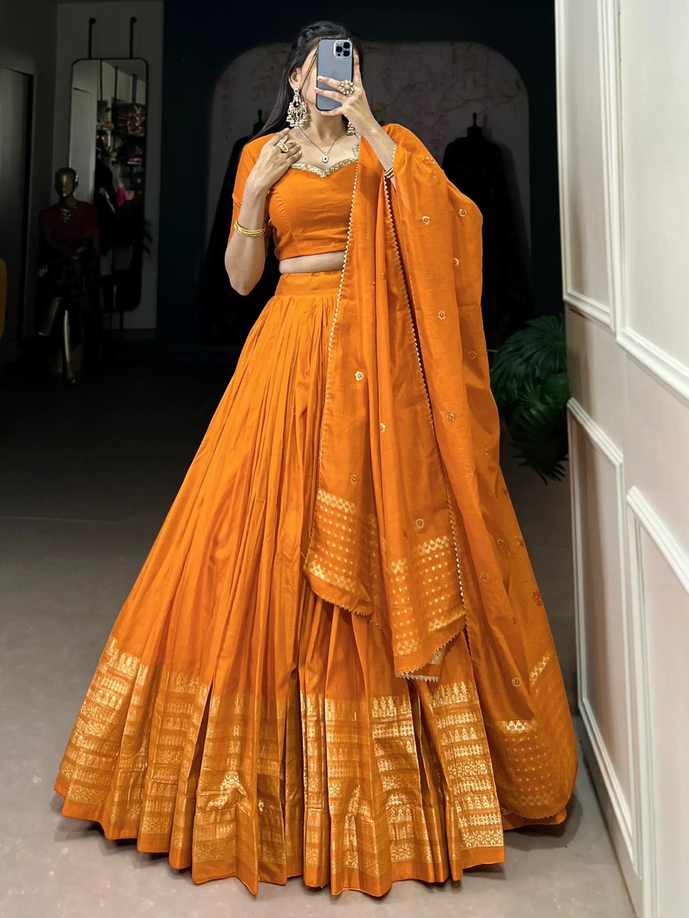Orange designer lehenga choli with gold embroidery, perfect for Indian ethnic wear occasions