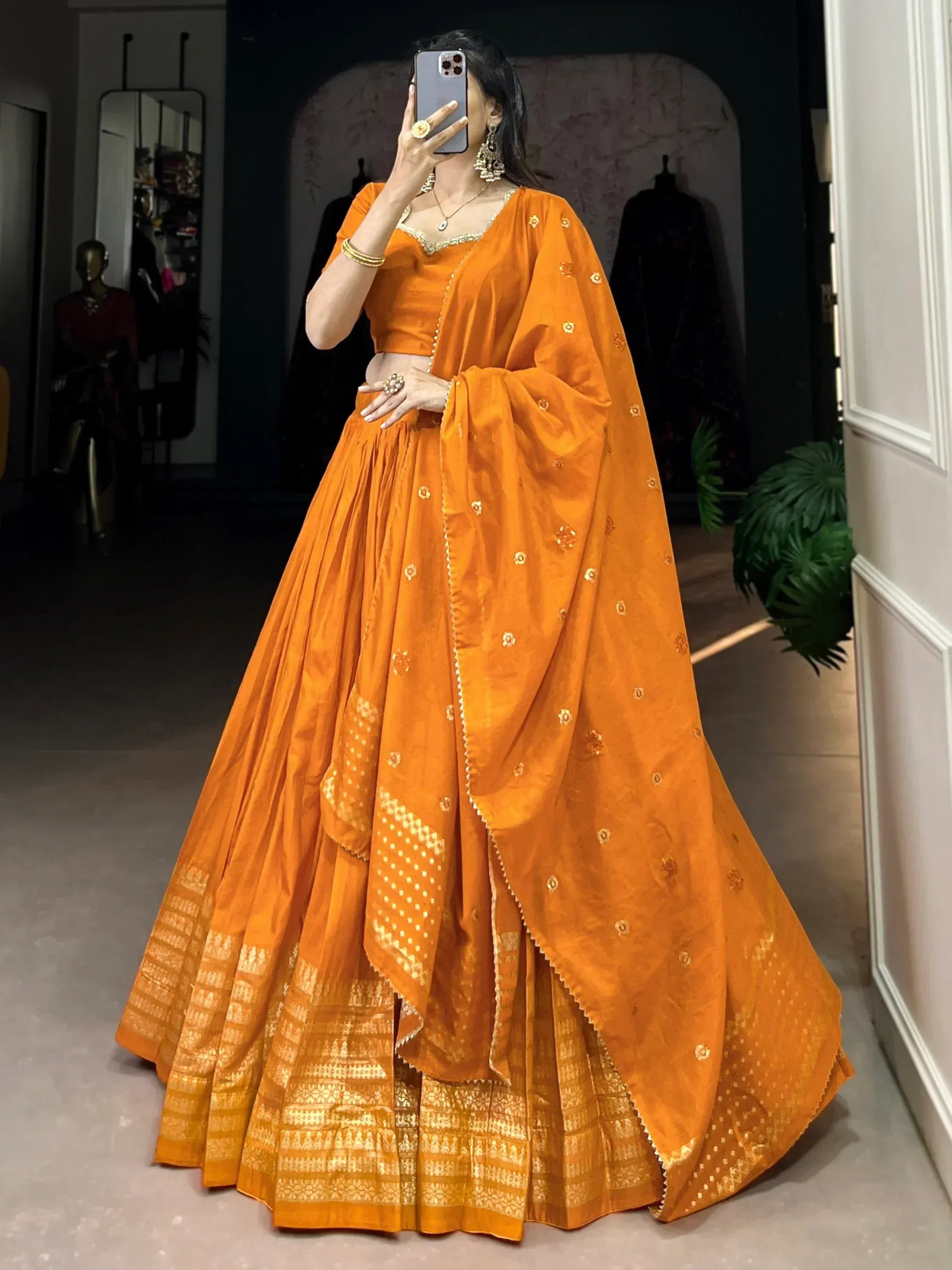 Orange designer lehenga choli with gold embroidery, perfect for Indian ethnic wear occasions