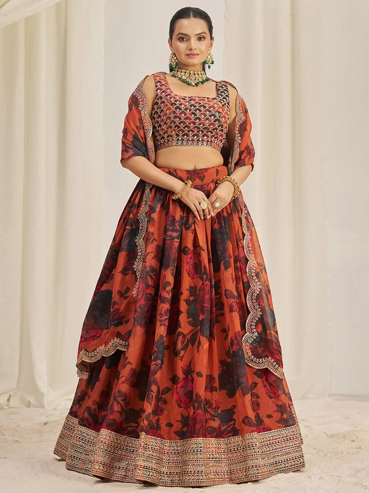 Orange floral lehenga choli with embroidered crop top and dupatta, perfect for Indian weddings and festive occasions