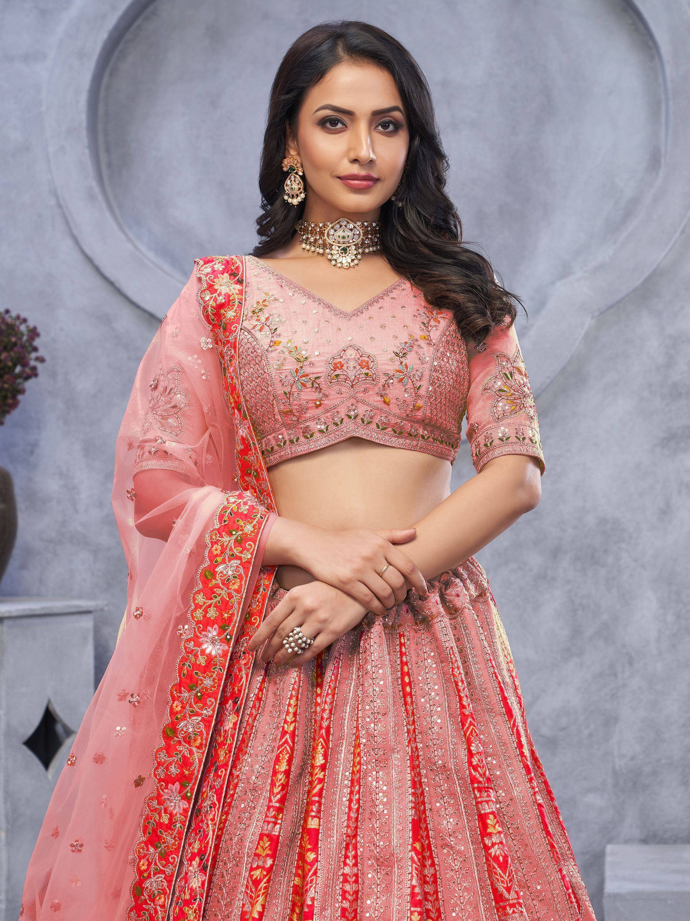 Pink embroidered lehenga choli with floral dupatta, perfect for Indian weddings and festive occasions