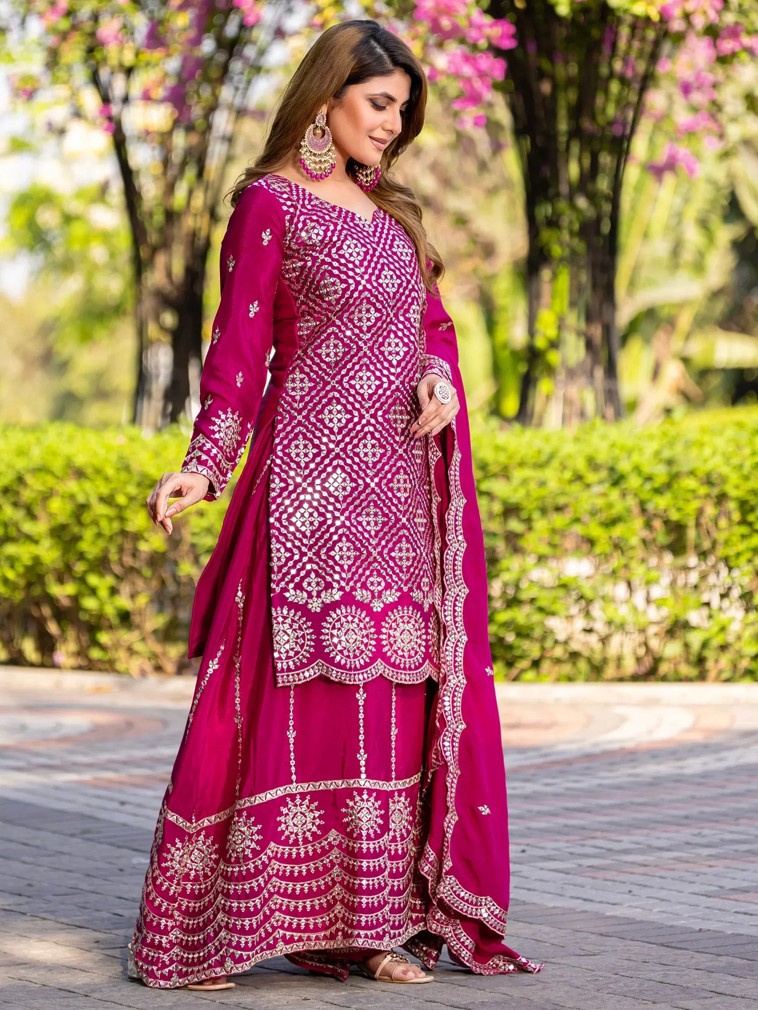Elegant magenta salwar kameez with intricate silver embroidery, perfect for Indian ethnic wear occasions.