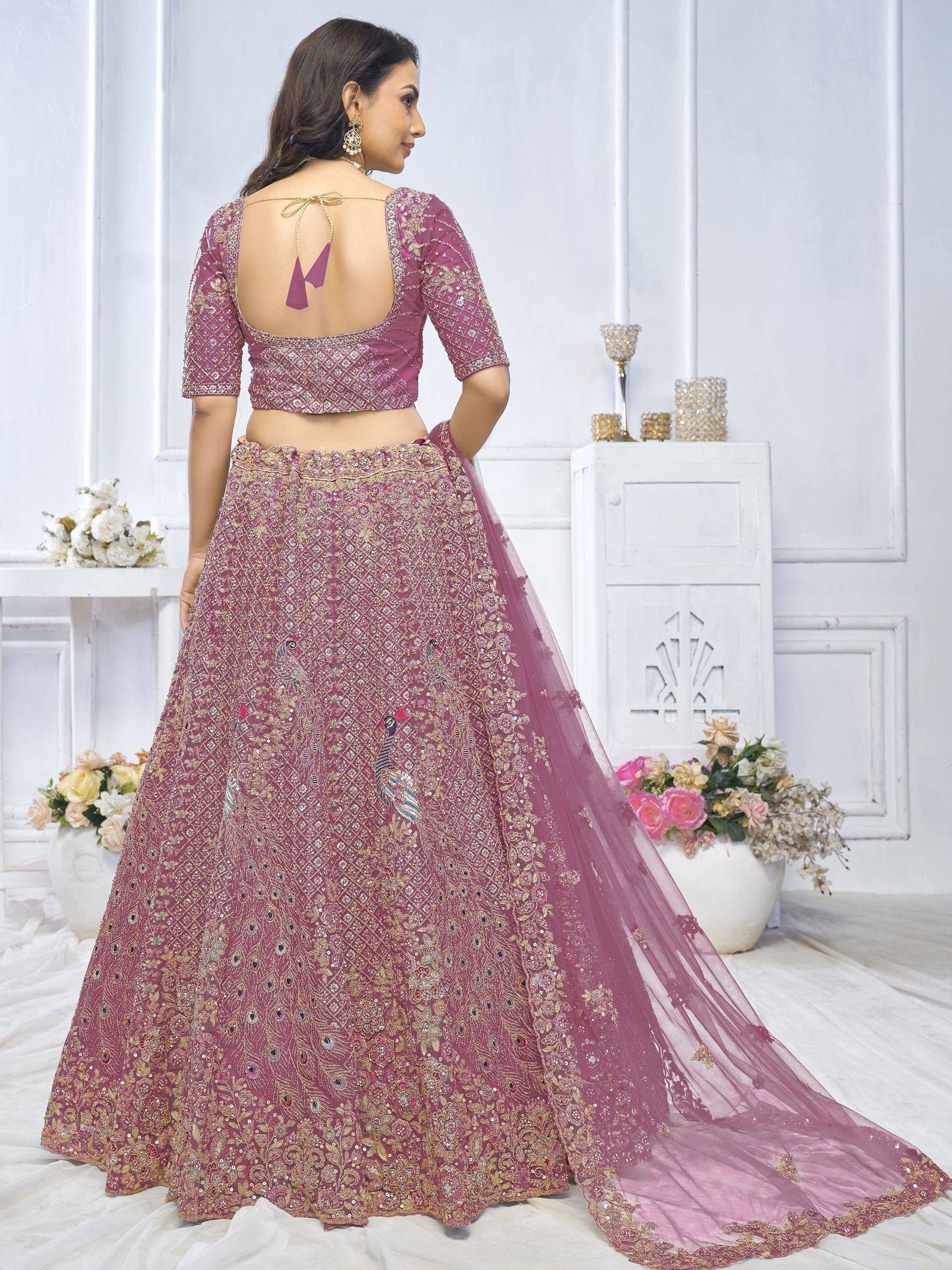 Pink designer lehenga choli with peacock embroidery and back tie blouse, perfect for weddings and festivals
