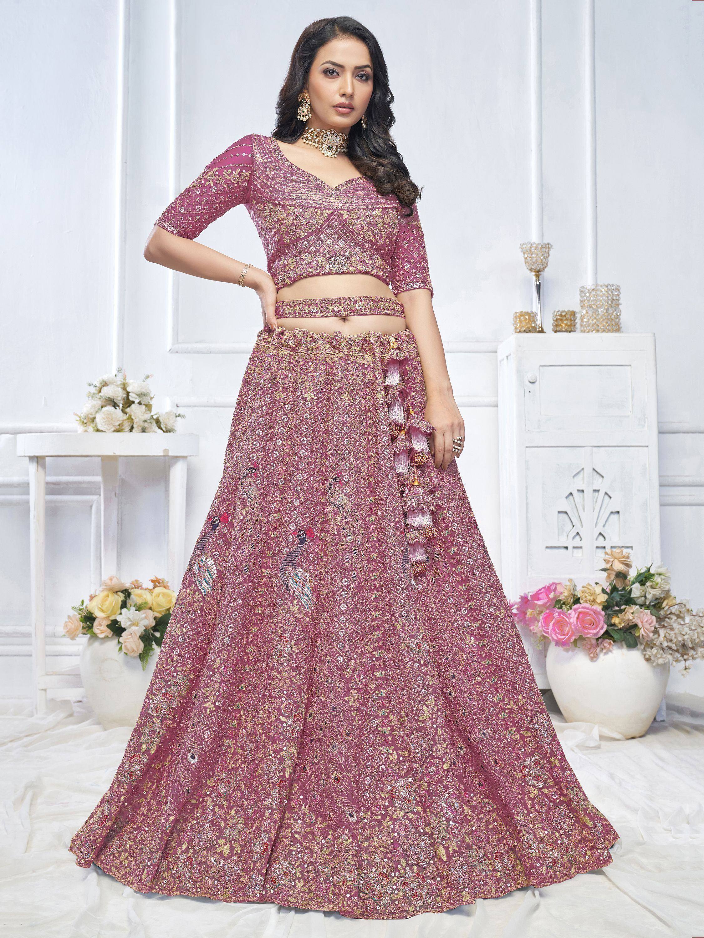 Pink embroidered lehenga choli with peacock motifs, perfect for Indian weddings and festive occasions