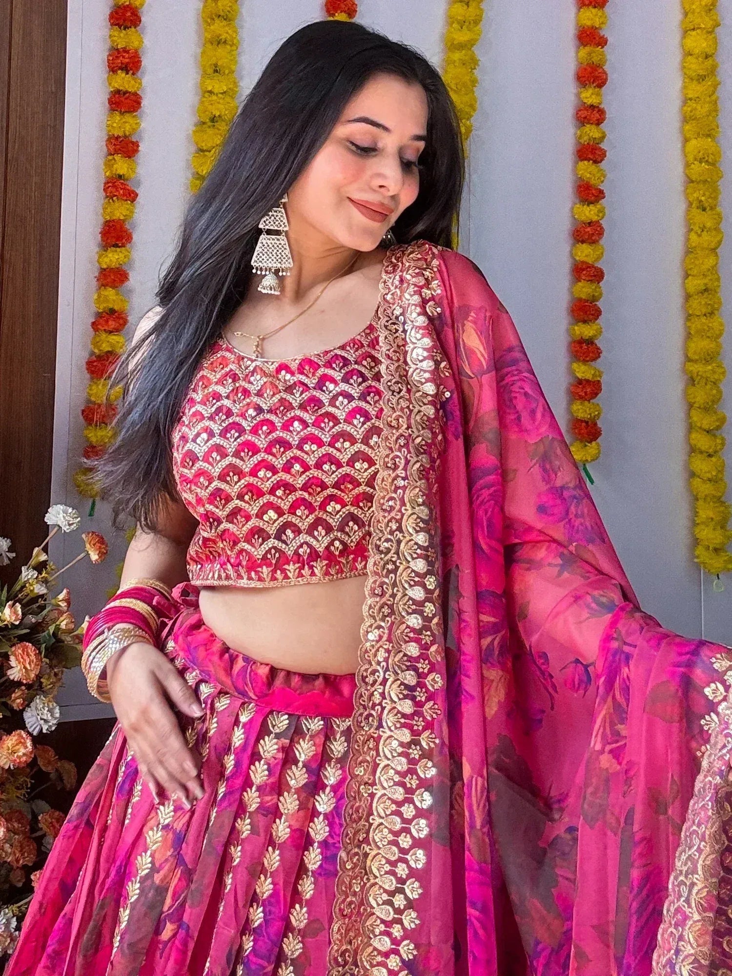 Pink embroidered lehenga choli with floral dupatta, perfect for Indian weddings and festivals