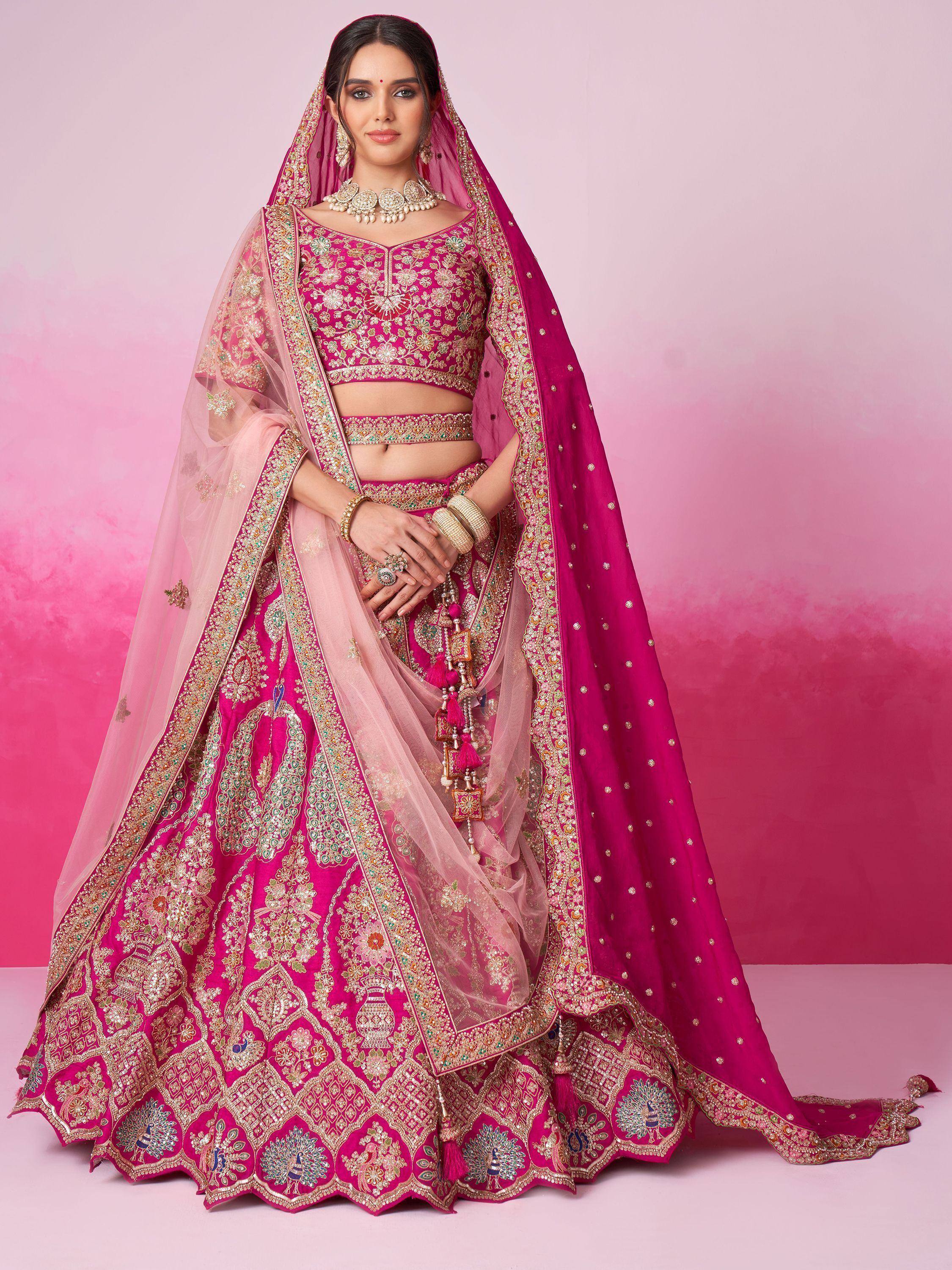 Pink embroidered lehenga choli with peacock motifs and sheer dupatta for Indian ethnic wear