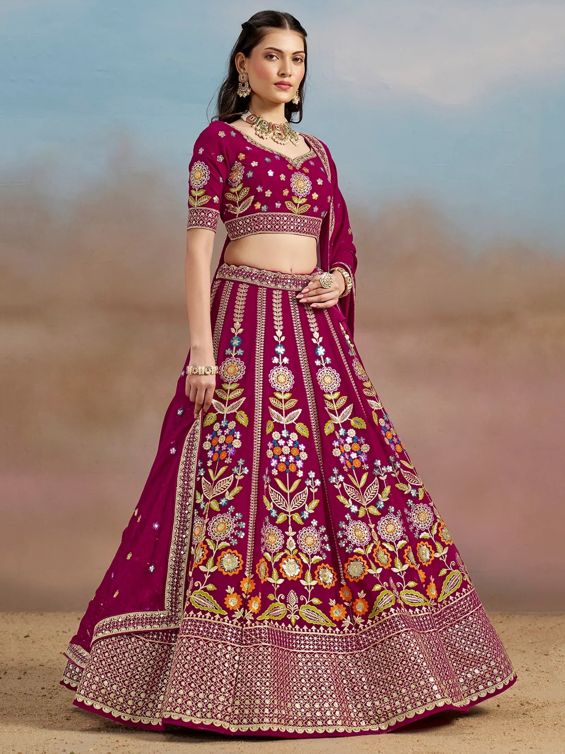 Elegant maroon lehenga choli with floral embroidery, perfect for Indian weddings and festive occasions.