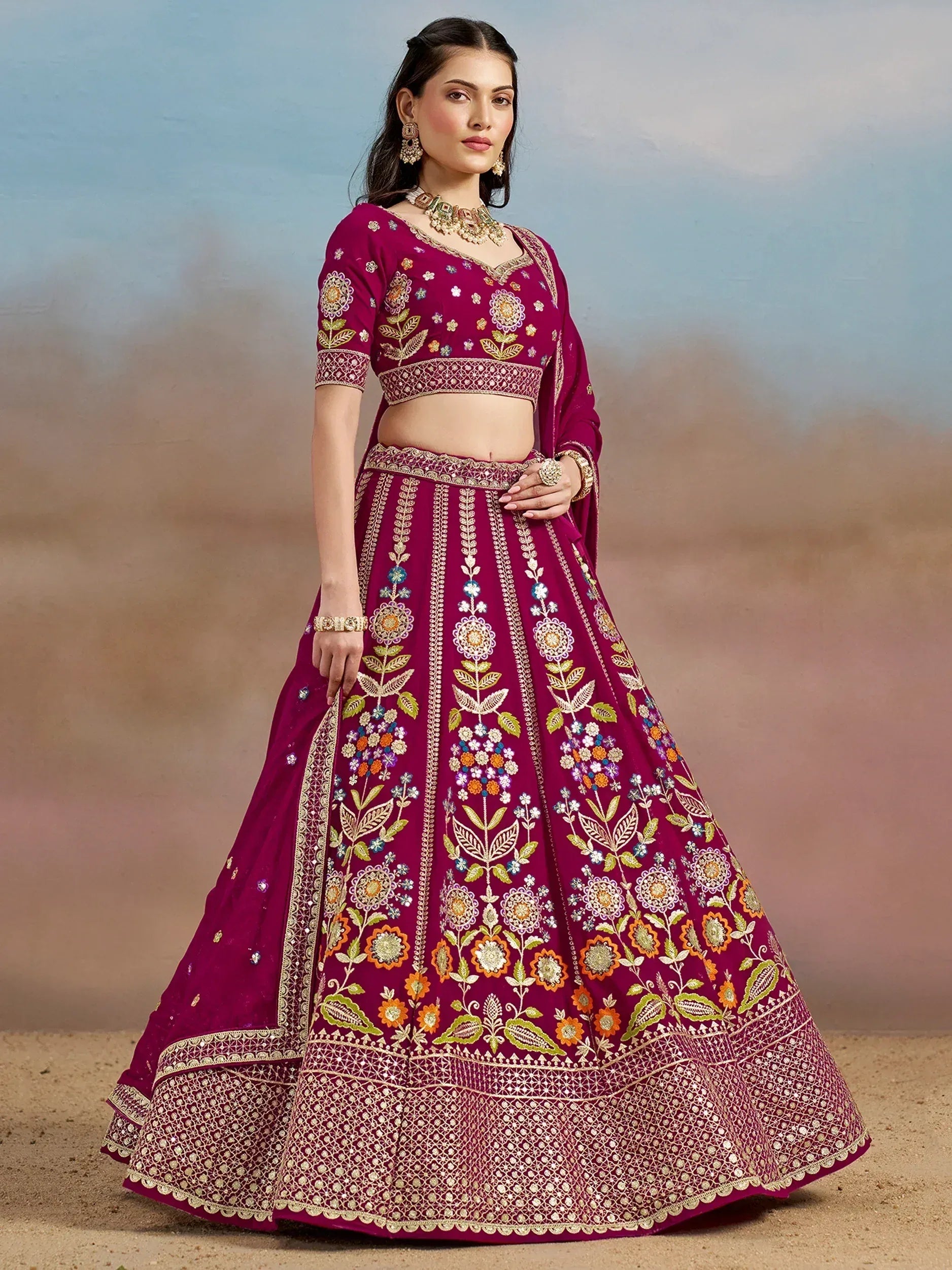 Elegant maroon lehenga choli with floral embroidery, perfect for Indian weddings and festive occasions.