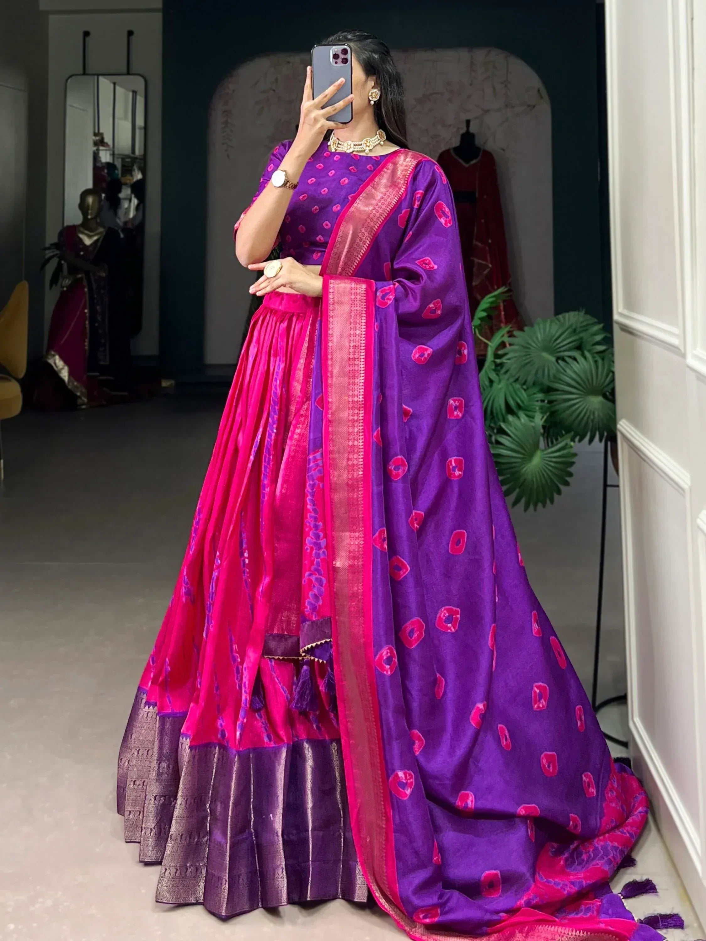 Purple and pink designer lehenga choli with floral print and gold border, perfect for Indian ethnic wear